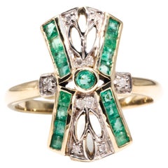 Circa 1990s, 9 Carat Yellow Gold Diamond and Green Emerald Vintage Dress Ring