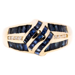 Circa 1990s Channel Set Sapphire and Diamond Vintage 18 Carat Gold Cluster Ring