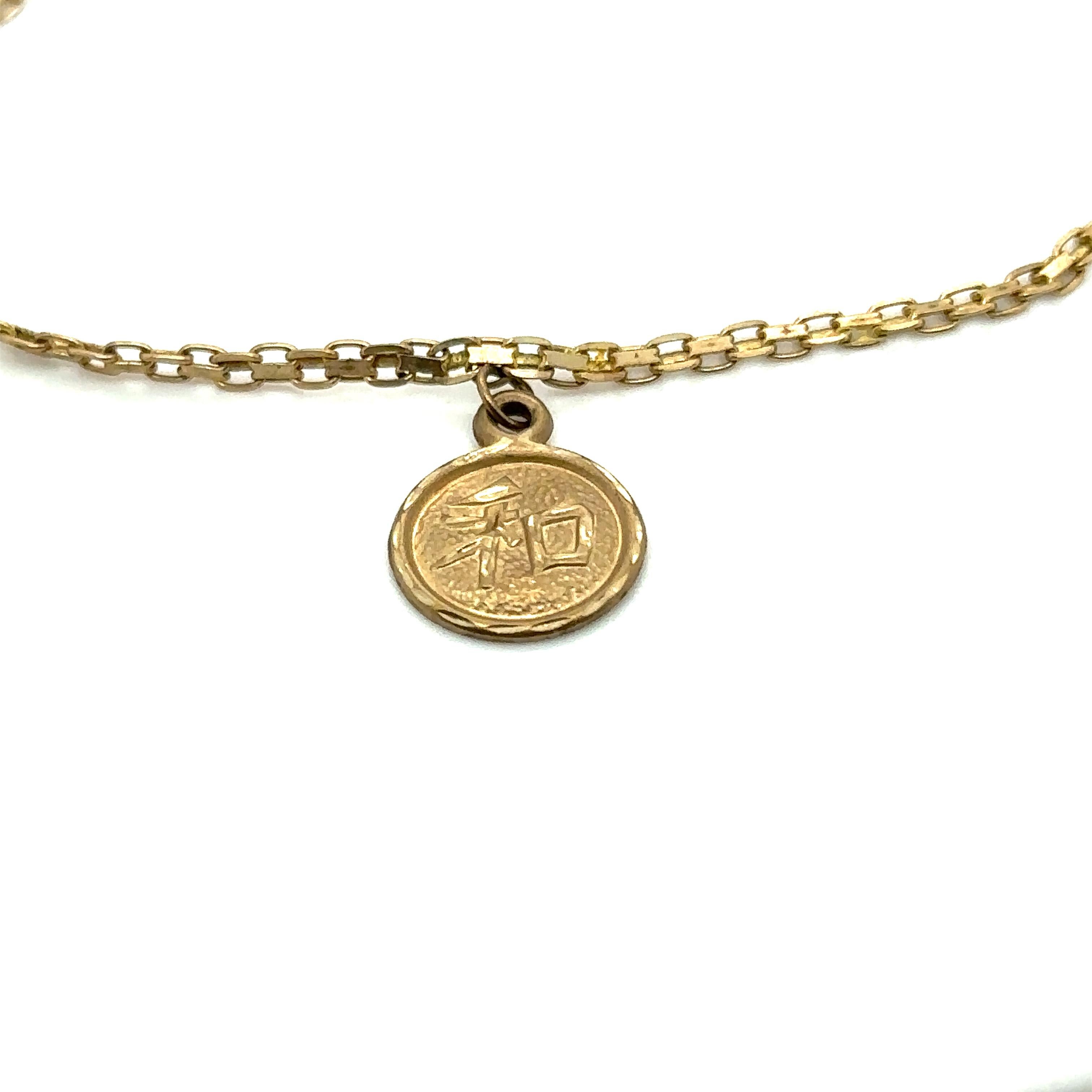 Circa 1990s Chinese Character Charm Bracelet in 10 Karat Gold For Sale 1