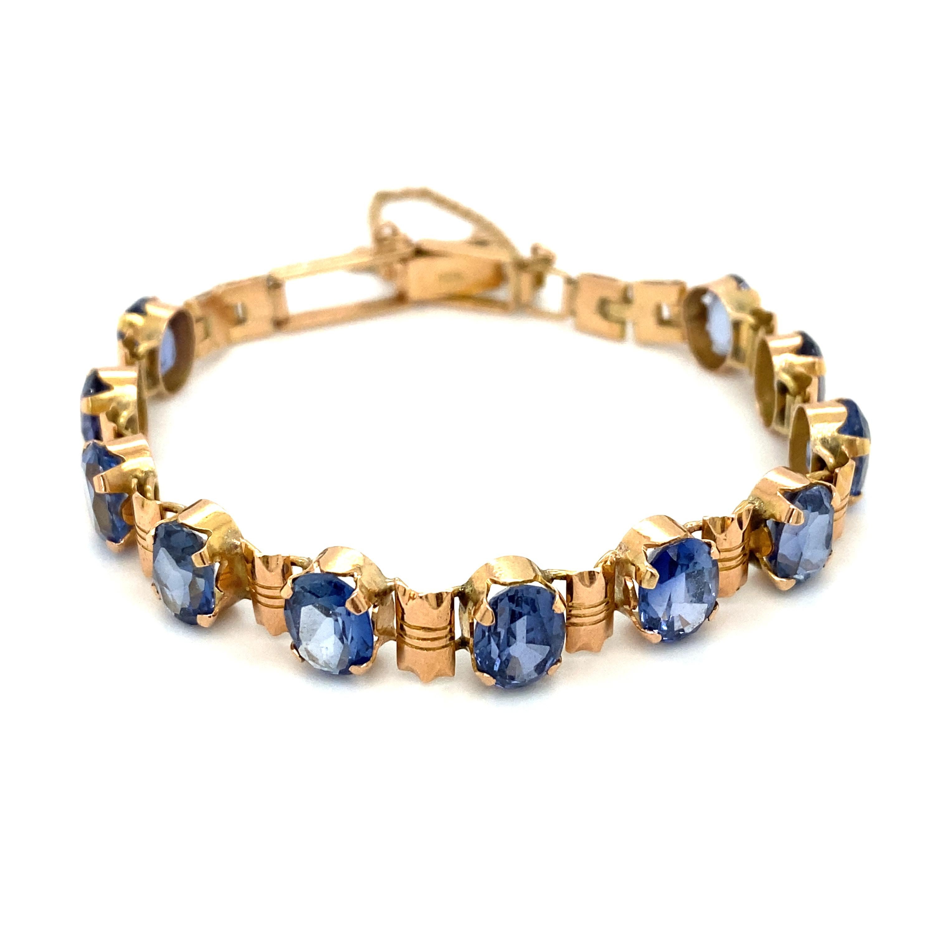Oval Cut Circa 1990s Oval Iolite Bracelet in 14 Karat Yellow Gold For Sale