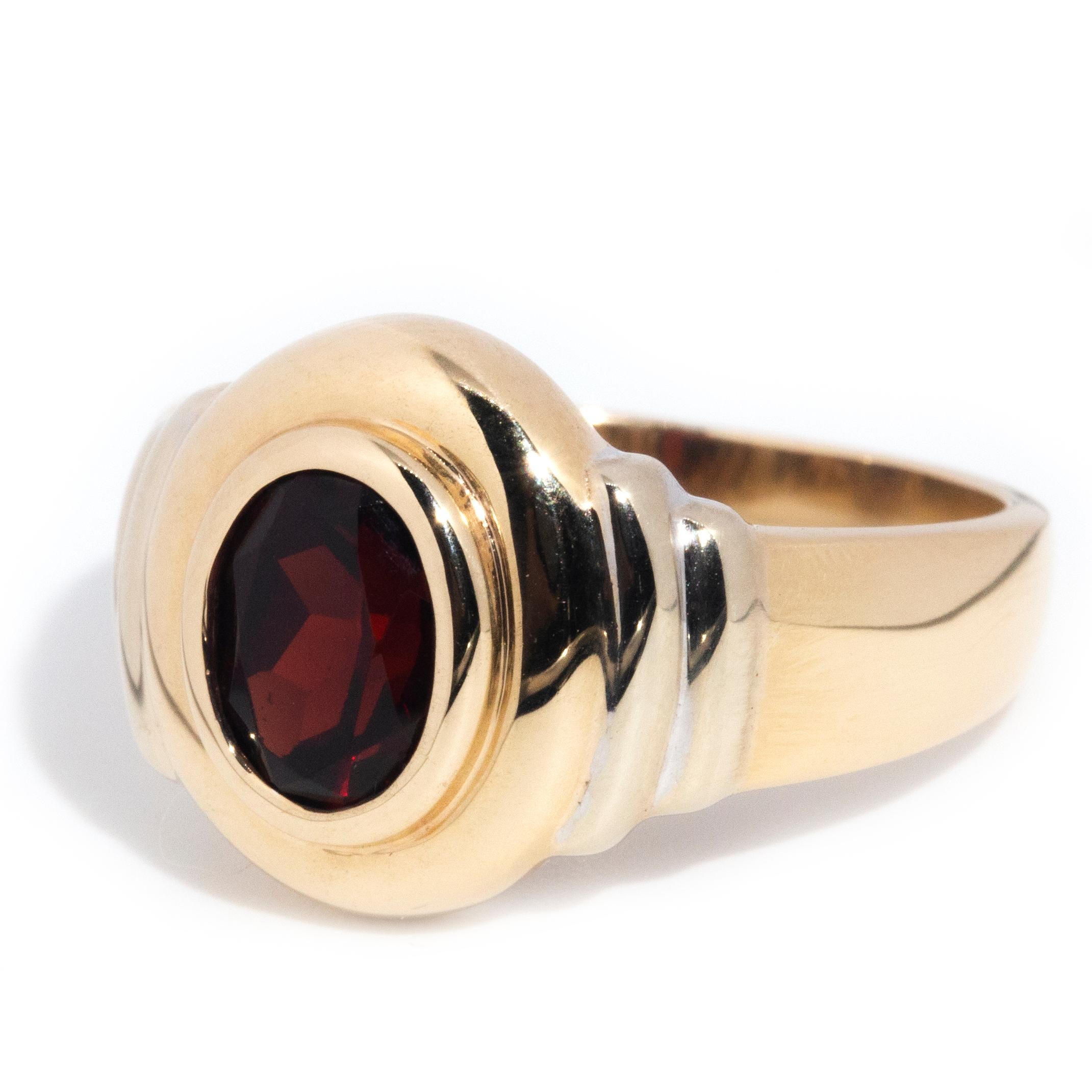 circa 1990s, Vintage 9 Carat Yellow Gold Double Rub over Oval Cut Garnet Ring In Good Condition For Sale In Hamilton, AU
