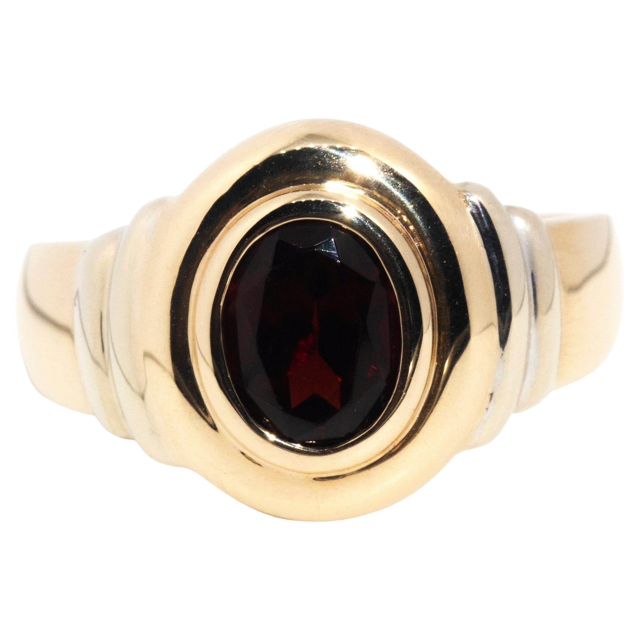 circa 1990s, Vintage 9 Carat Yellow Gold Double Rub over Oval Cut Garnet Ring For Sale