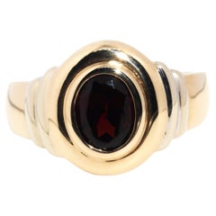 circa 1990s, Vintage 9 Carat Yellow Gold Double Rub over Oval Cut Garnet Ring