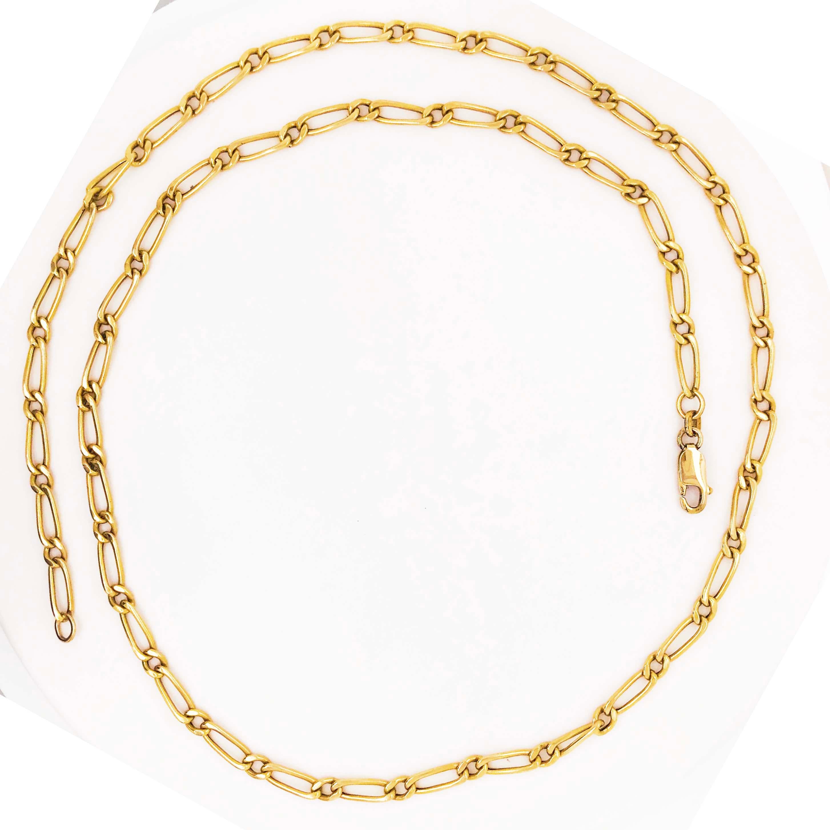 The CIRCA 1995 gold link chain has handmade links made in precious metal, 14 karat yellow gold. The chain has a figaro link pattern that has a classic, timeless look. Figaro chains have been a fashion chain for generations, they are a staple in
