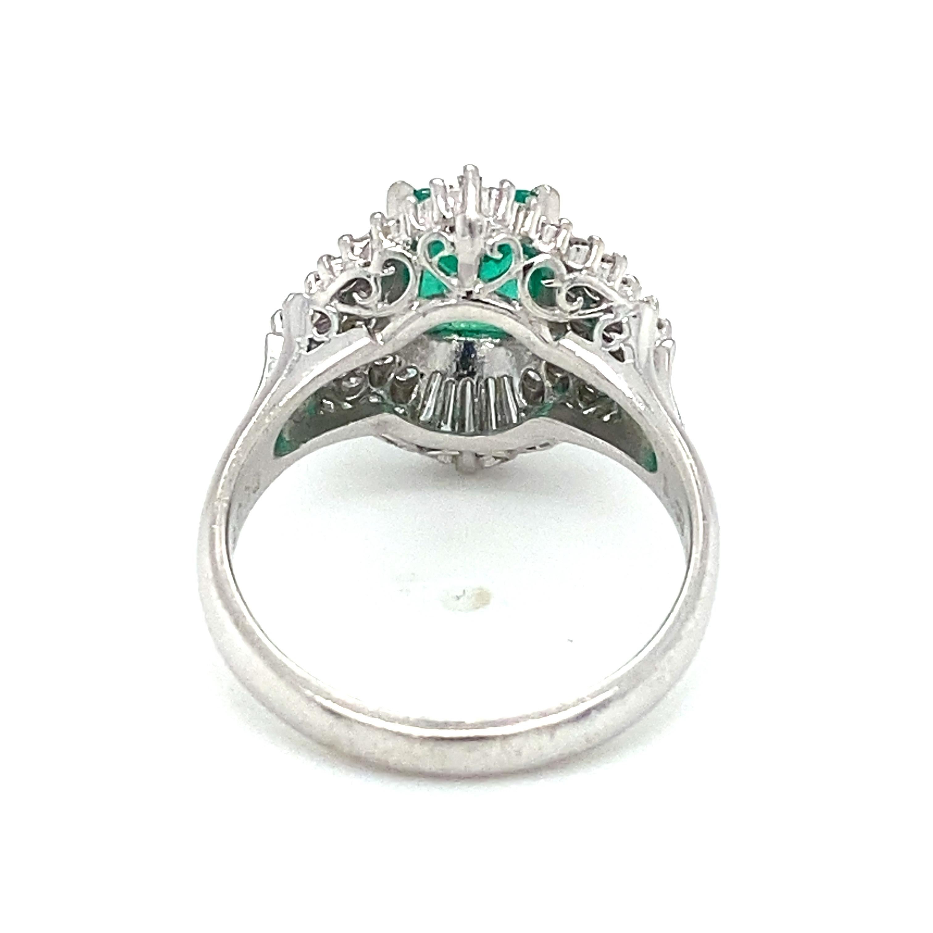 tem Details: This spectacular ring features a center emerald at over a carat, surrounded by round and baguette diamonds at just over half a carat total weight. This piece makes a beautiful engagement ring or anniversary gift. The center emerald is