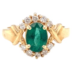 Circa 2000s 1.30 Carat Oval Emerald and Diamond Ring in 14 Karat Gold