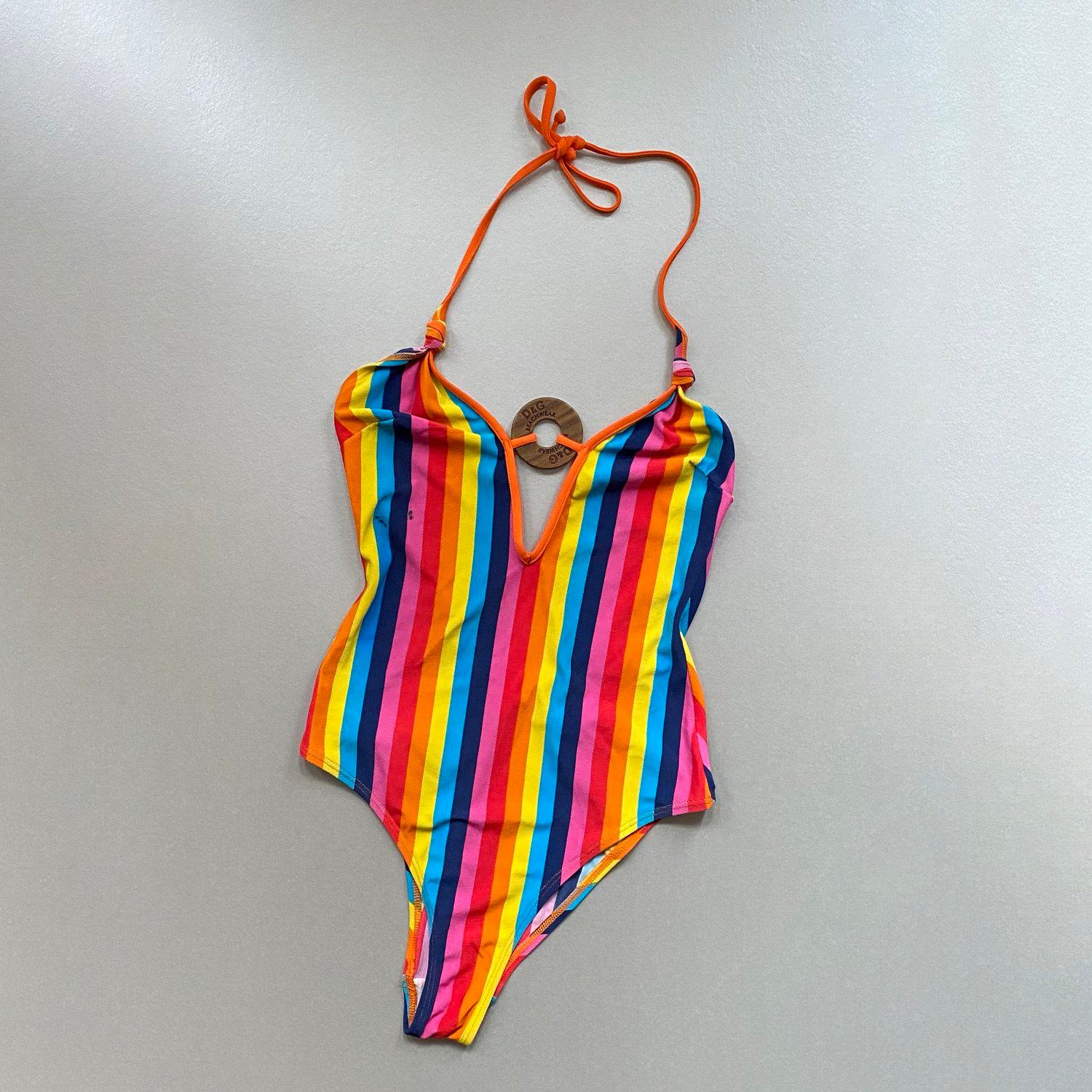 Vintage D&G by Dolce & Gabbana swimsuit. Rainbow stripe with wooden D&G circle logo. Halter style with low back. D&G authenticity label to the inner. Similar to the Spring Summer 2002 Dolce & Gabbana runway collection, and produced at the same