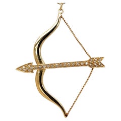 Circa 2000s Diamond Bow and Arrow Pendant and Chain in 14K Gold