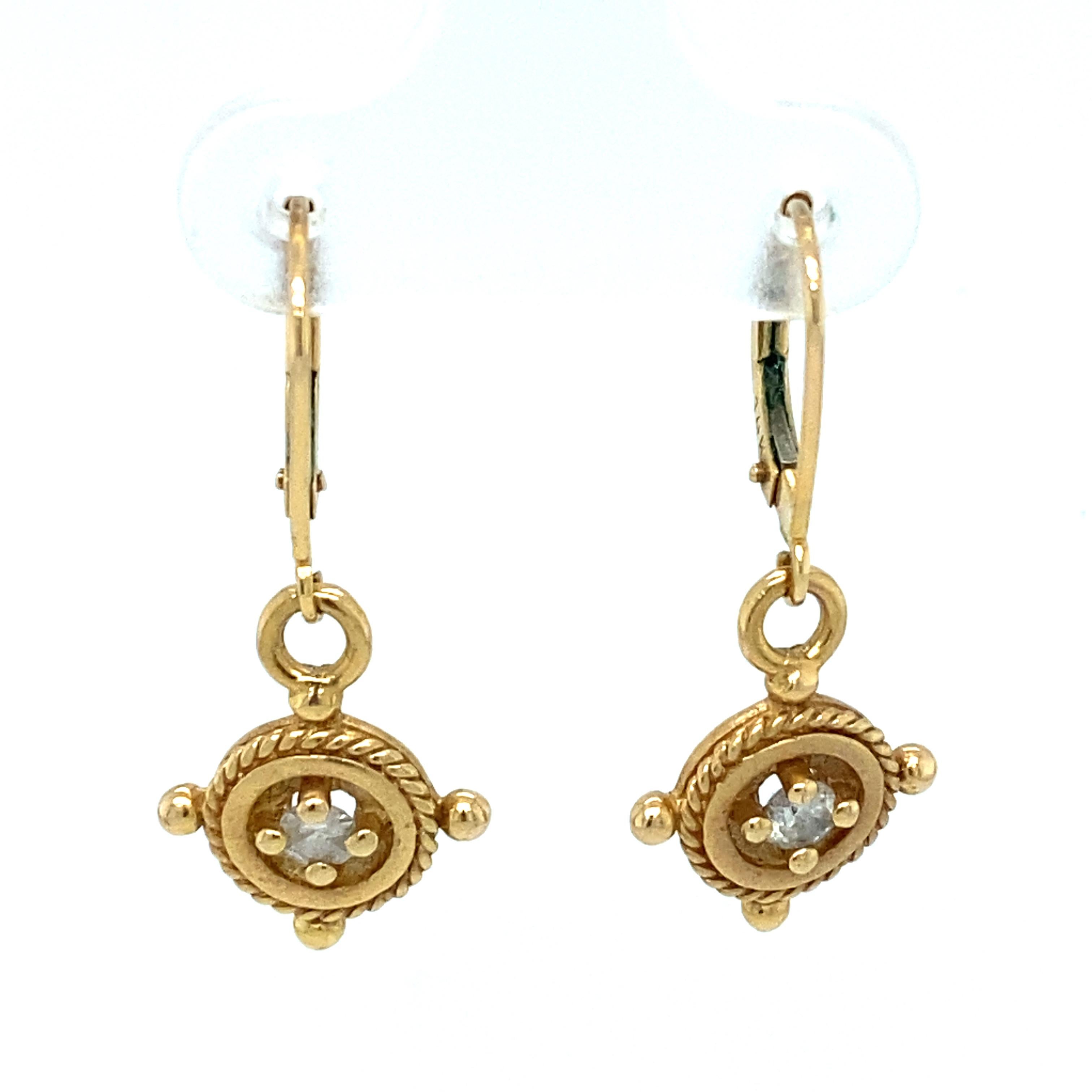 Item Details: These earrings have a unique circular design with diamonds in the center. They have lever backs and are crafted in 14 Karat Gold.

Circa: 2000s
Metal Type: 14 Karat Yellow Gold
Weight: 3.2 grams

Diamond Details:

Carat: Approximately