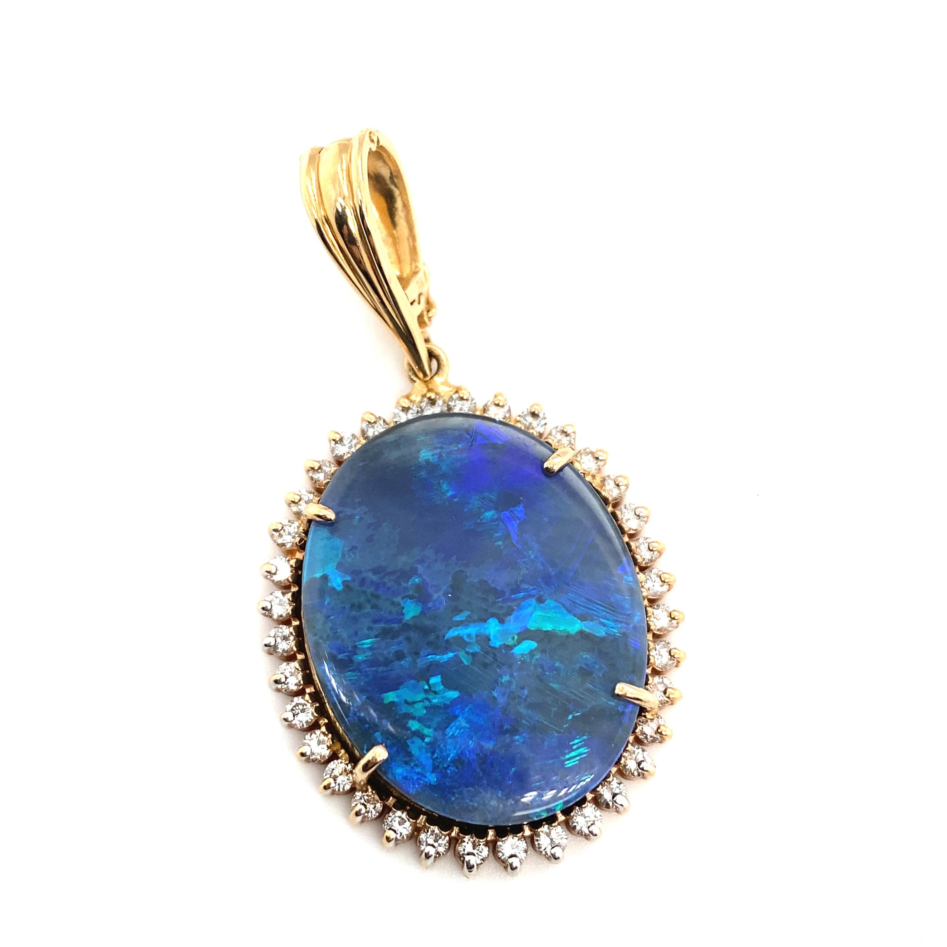 Women's or Men's Circa 2000s Oval Opal Doublet Pendant with Diamonds in 14 Karat Yellow Gold For Sale