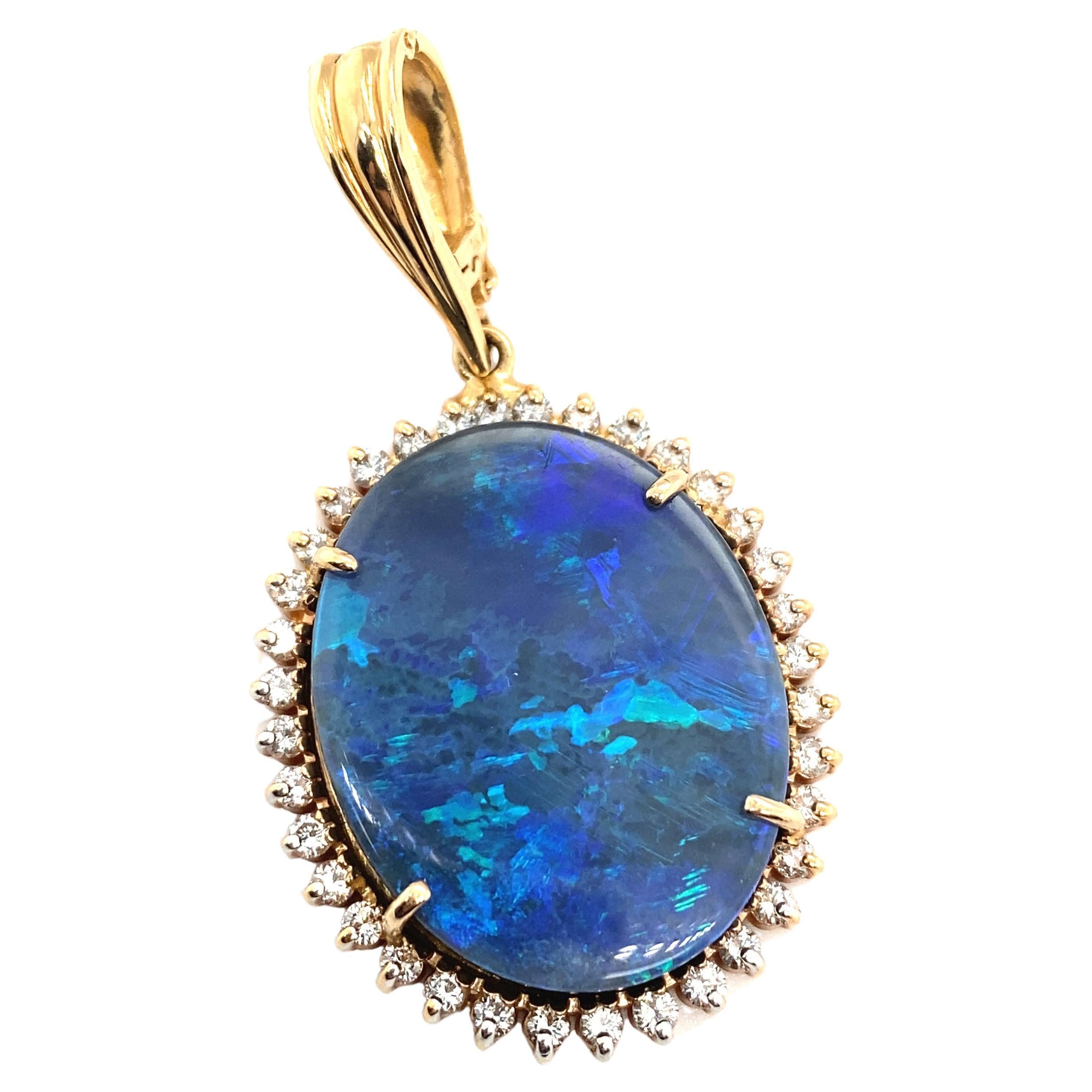 Circa 2000s Oval Opal Doublet Pendant with Diamonds in 14 Karat Yellow Gold For Sale