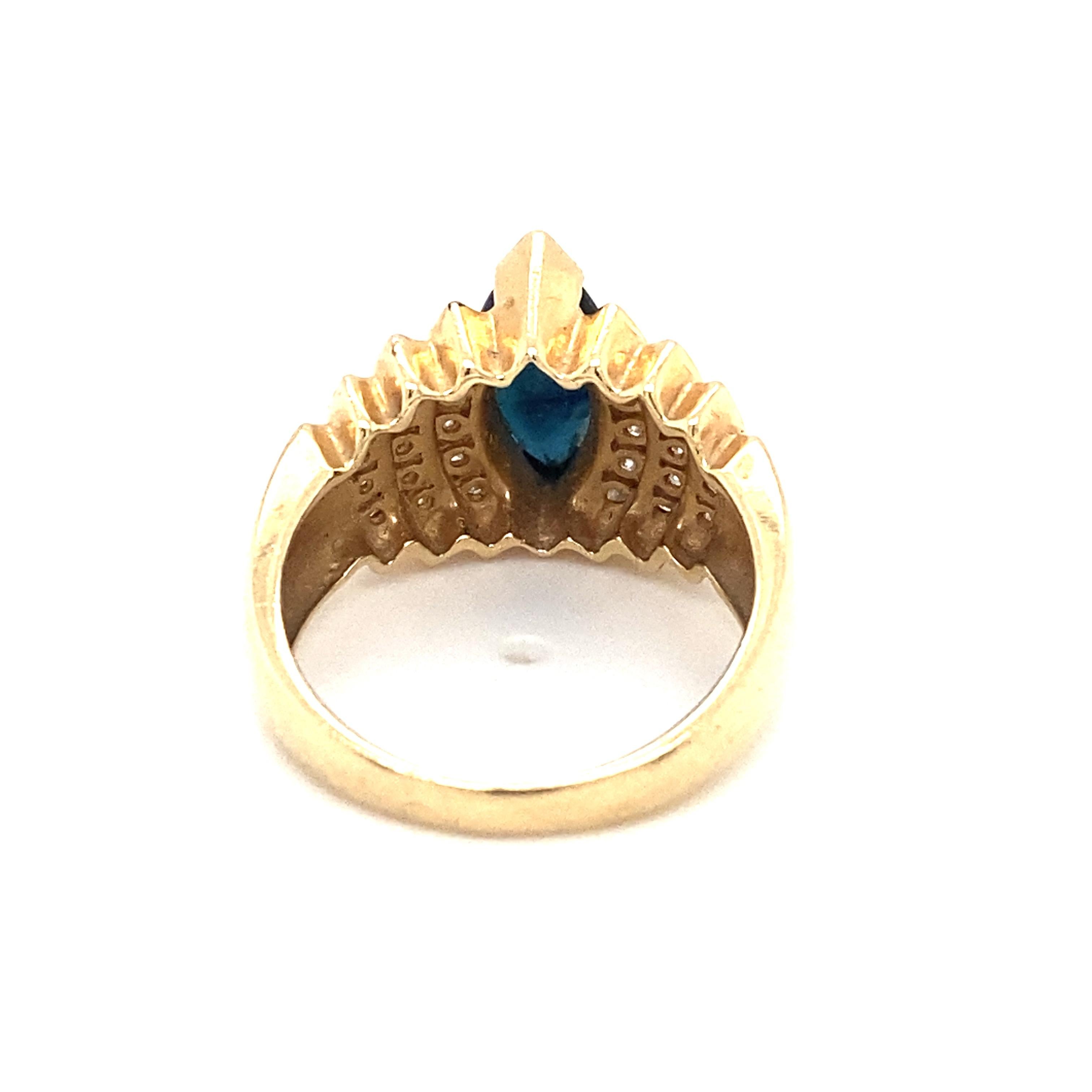 Item Details: This ring has a marquise sapphire and accent diamonds in a waterfall design.

Circa: 2000s
Metal Type: 14k yellow gold
Weight: 7.7g
Size: US 8, resizable