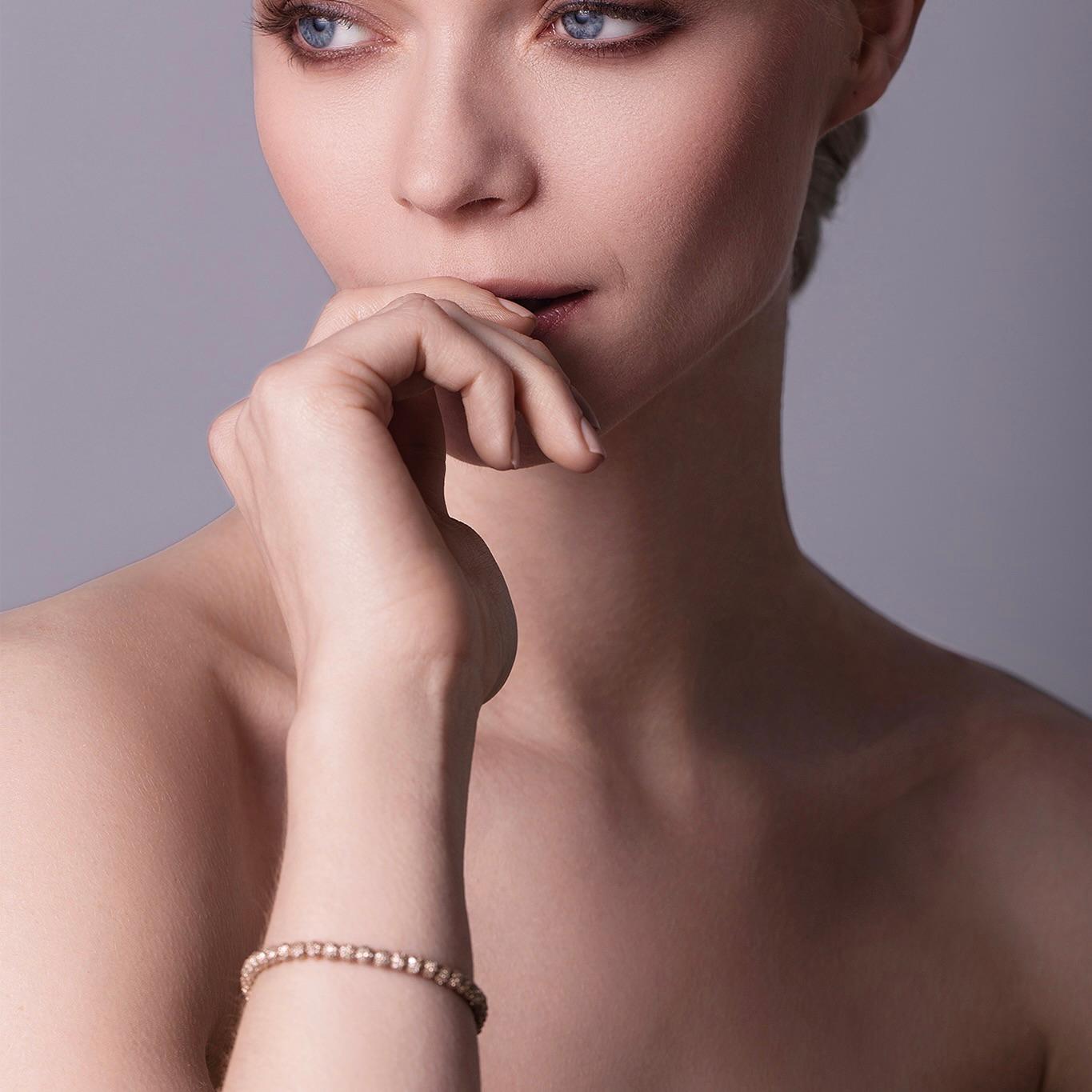 A new take on a classic tennis bracelet. This beautifully handmade 18-karat yellow gold bracelet is encrusted with sparkling free turning diamond beads and a double-sided diamond clasp. Each bead is created with the highest accuracy by artisans for