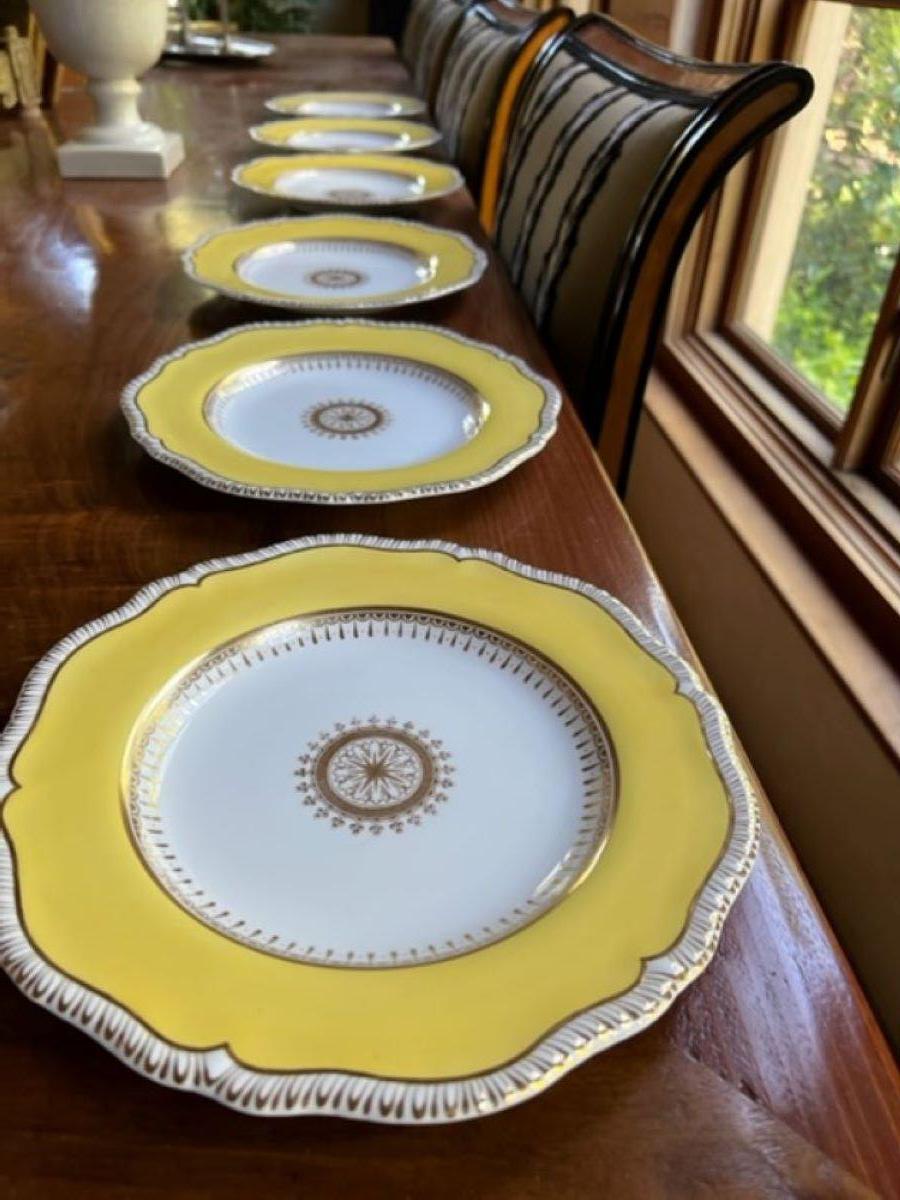 Set of six Copeland dinner plates, in vibrant yellow and gold detailing. The 10 inch plates have scalloped edges and are all stamped on bottom. These were made in the first part of the 20th century for the Ovington Brothers Department Store in New