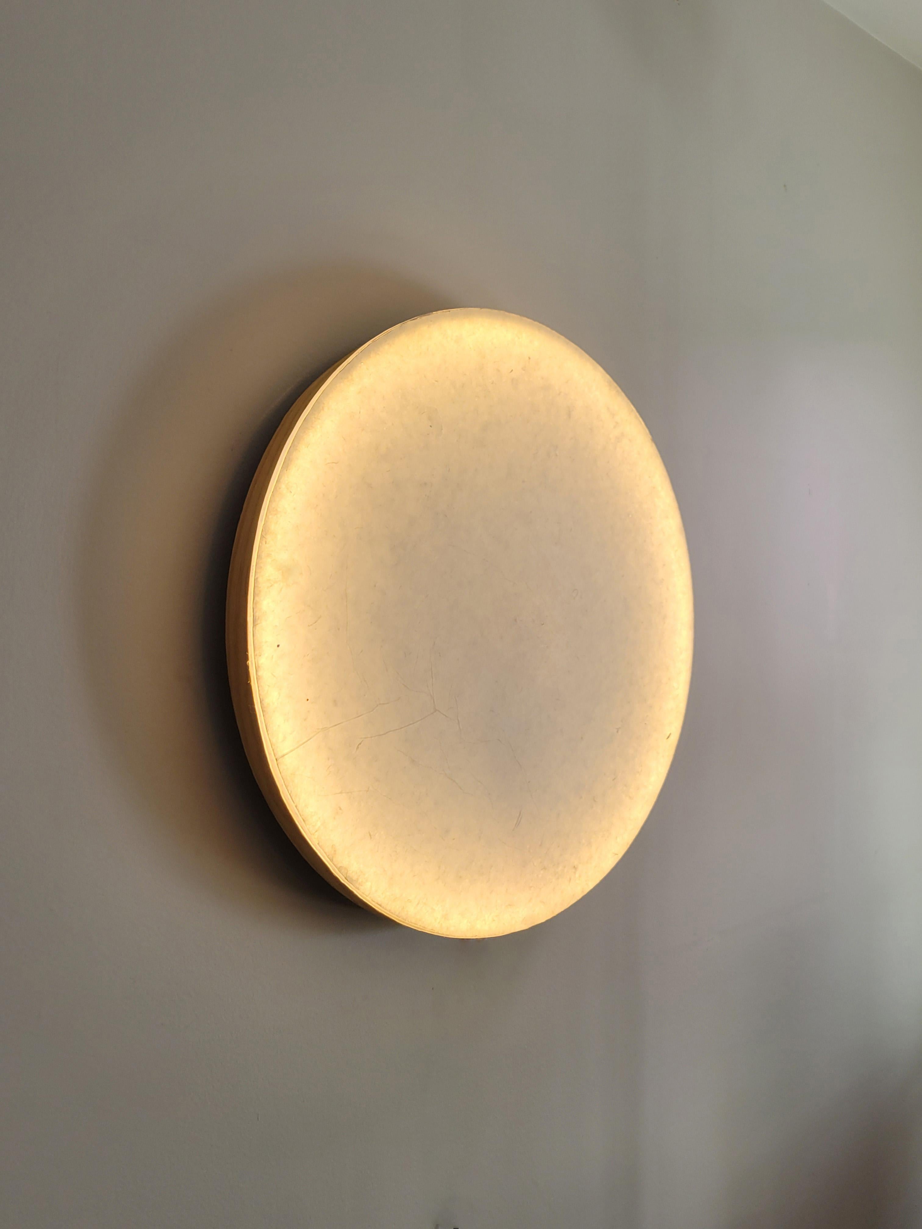 Circadian is the newest light object by Jason Robinson. Simple in form but unique in design, this 'intentional light object' is constructed of Nepalese washi paper laminated onto an acrylic disc. To adjust the light to your desired brightness,