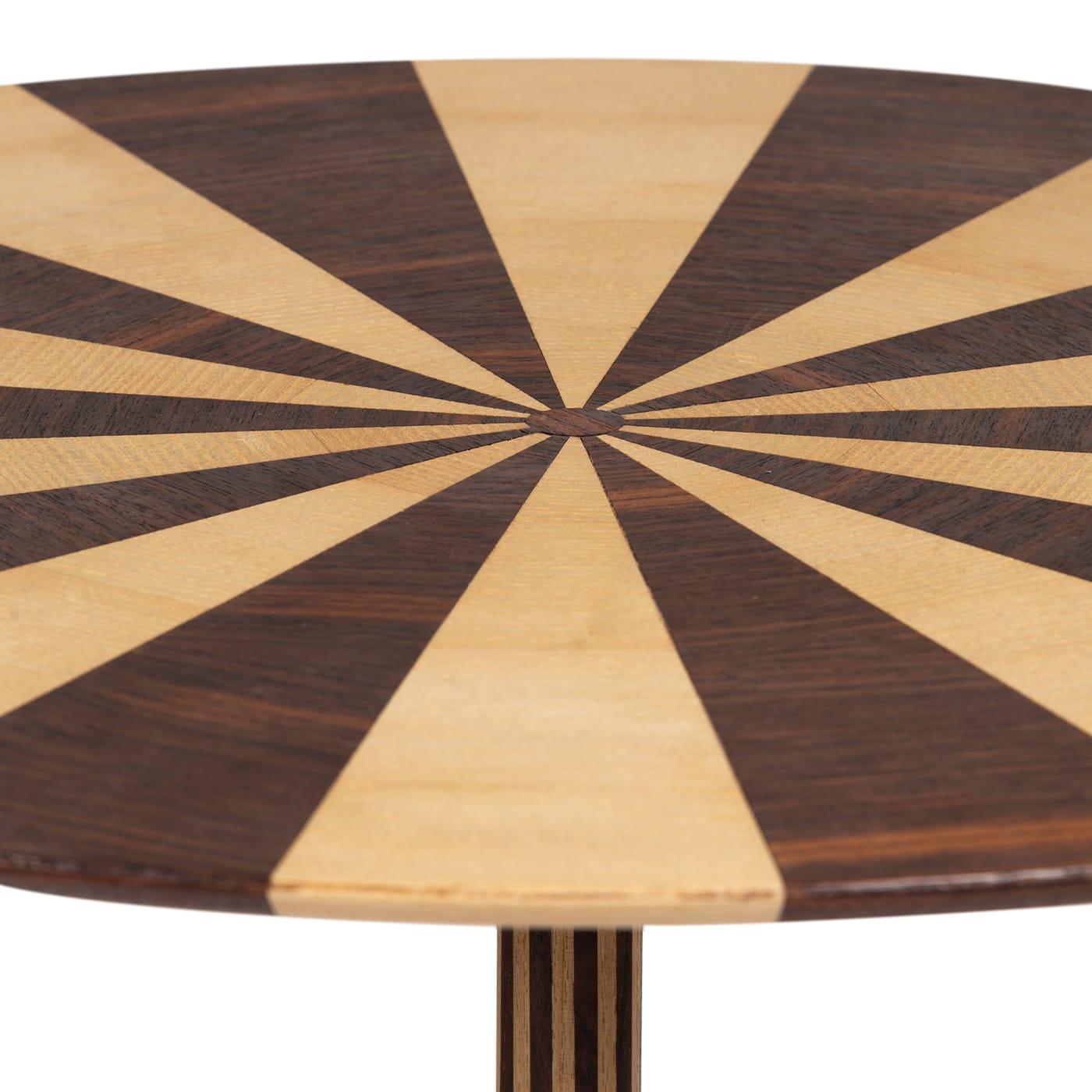 The captivating allure distinguishing this round tea table draws inspiration from the fragile balance of life. Part of the Circensi Collection, the design is marked by a wedge-like motif achieved by alternating stripes of ash and Rio rosewood. The