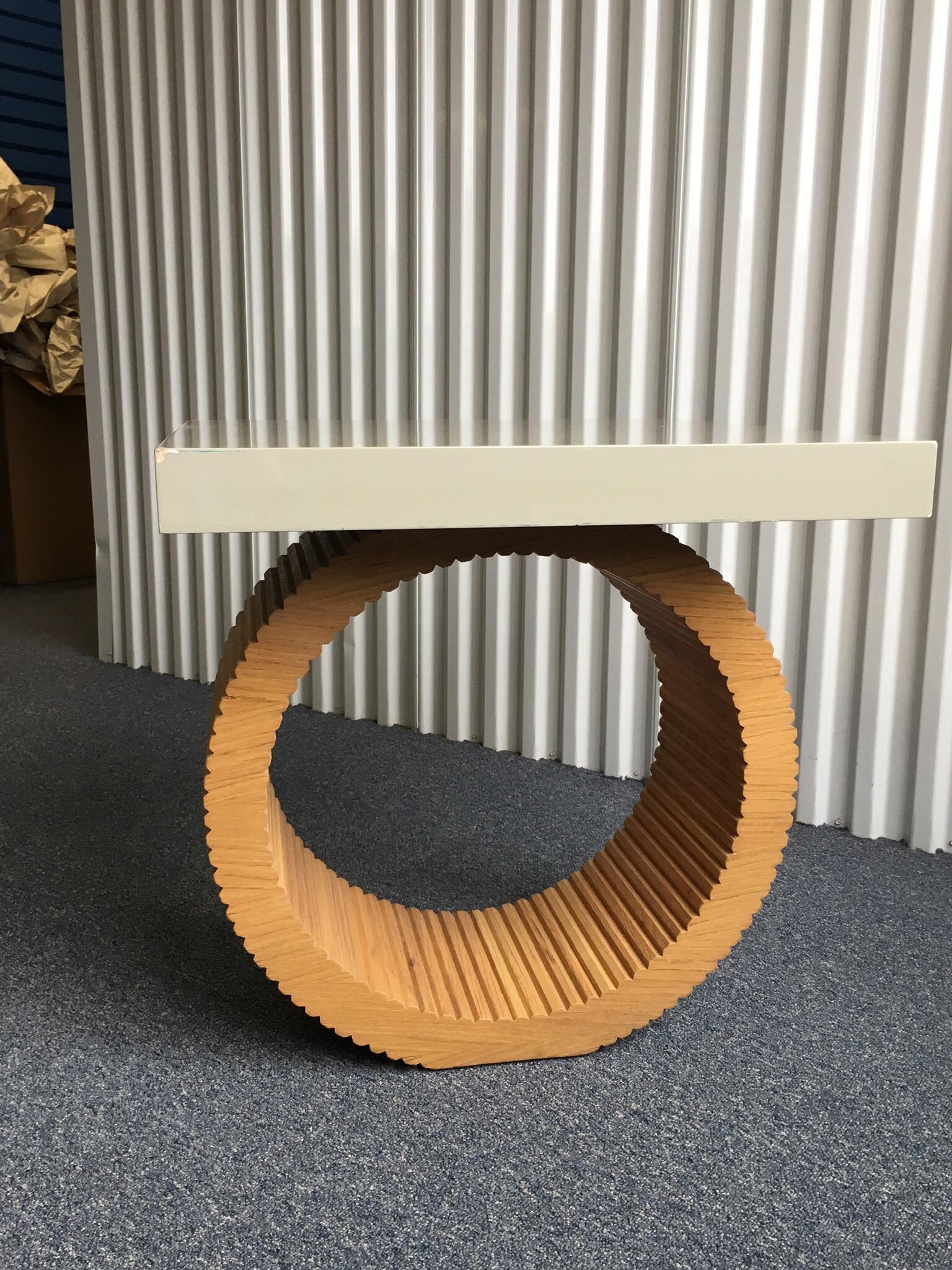 Circle and square shaped wood veneer and grey lacquered end table. Great form. The base is veneered in beaded wood pieces. The top is lacquered. The top has significant wear. Chips to the edge and scratches to the surface finish. Only one small loss