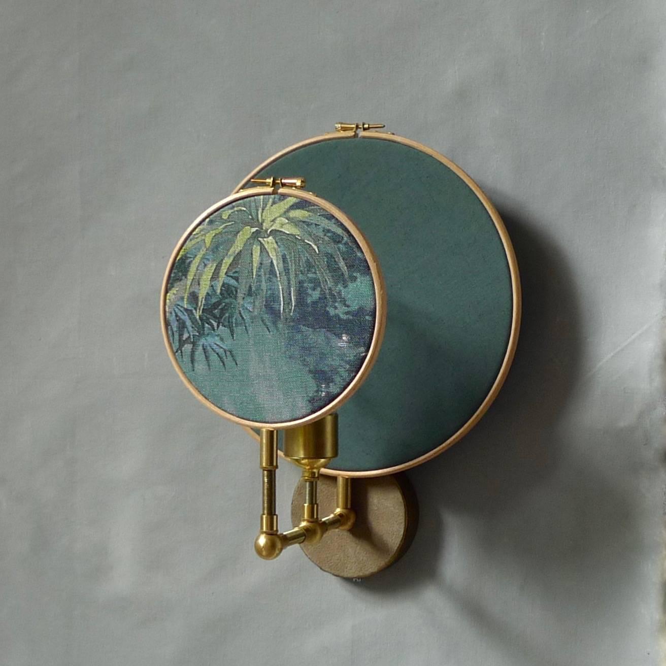 Circle blue grey wall sconce, Sander Bottinga
Handmade in brass, leather, wood and hand printed and painted linen.
A dimmer is inlaid with leather. Also possible without a dimmer
Dimensions: H 35 x W 27 x D 23 cm 
The design artwork is