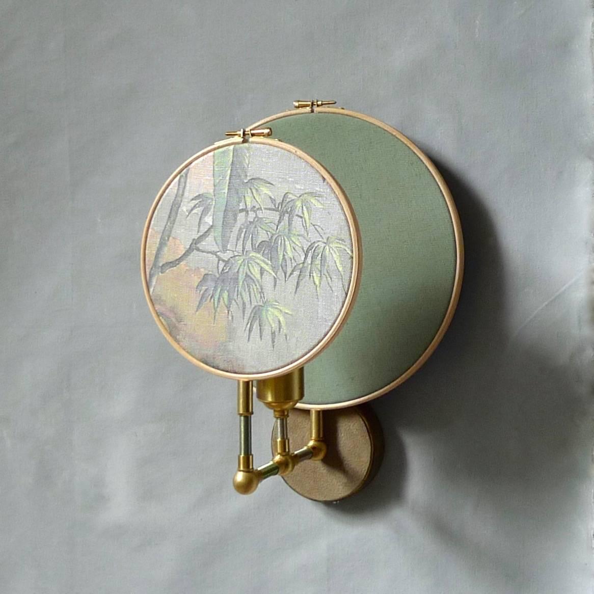 Circle blue grey, wall sconce, Sander Bottinga circle blue grey, wall sconce, Sander Bottinga
Handmade in brass, leather, wood and hand printed and painted linen.
A dimmer is inlaid with leather. Also possible without a dimmer
Dimensions: H 35 x