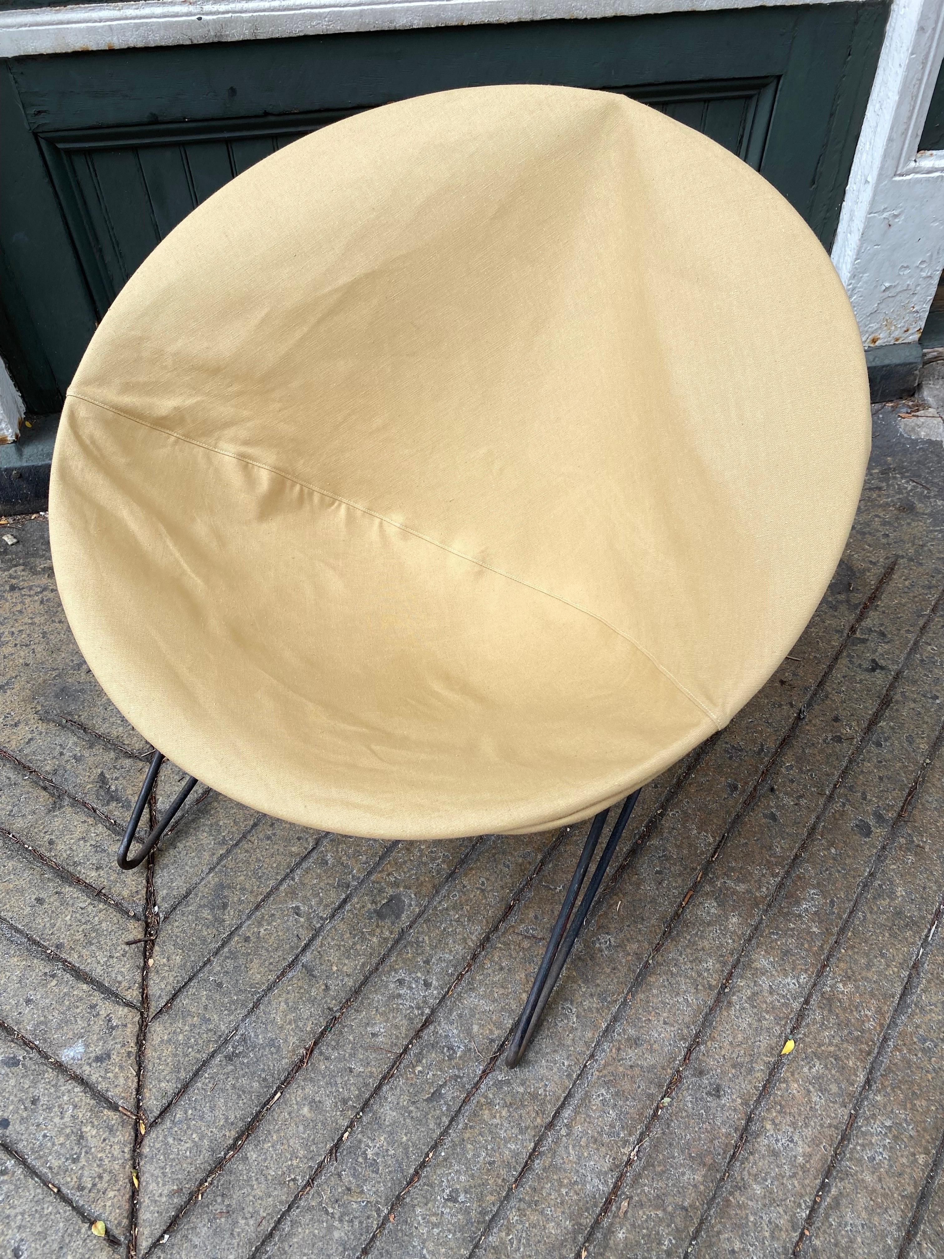 Iron and Canvas Circle Sling Chair. Newly reupholstered cover. Surprisingly sturdy and comfortable! Light weight makes it easy to move around where ever it might be needed! Throw a lambs wool skin on for a more upscale feel!