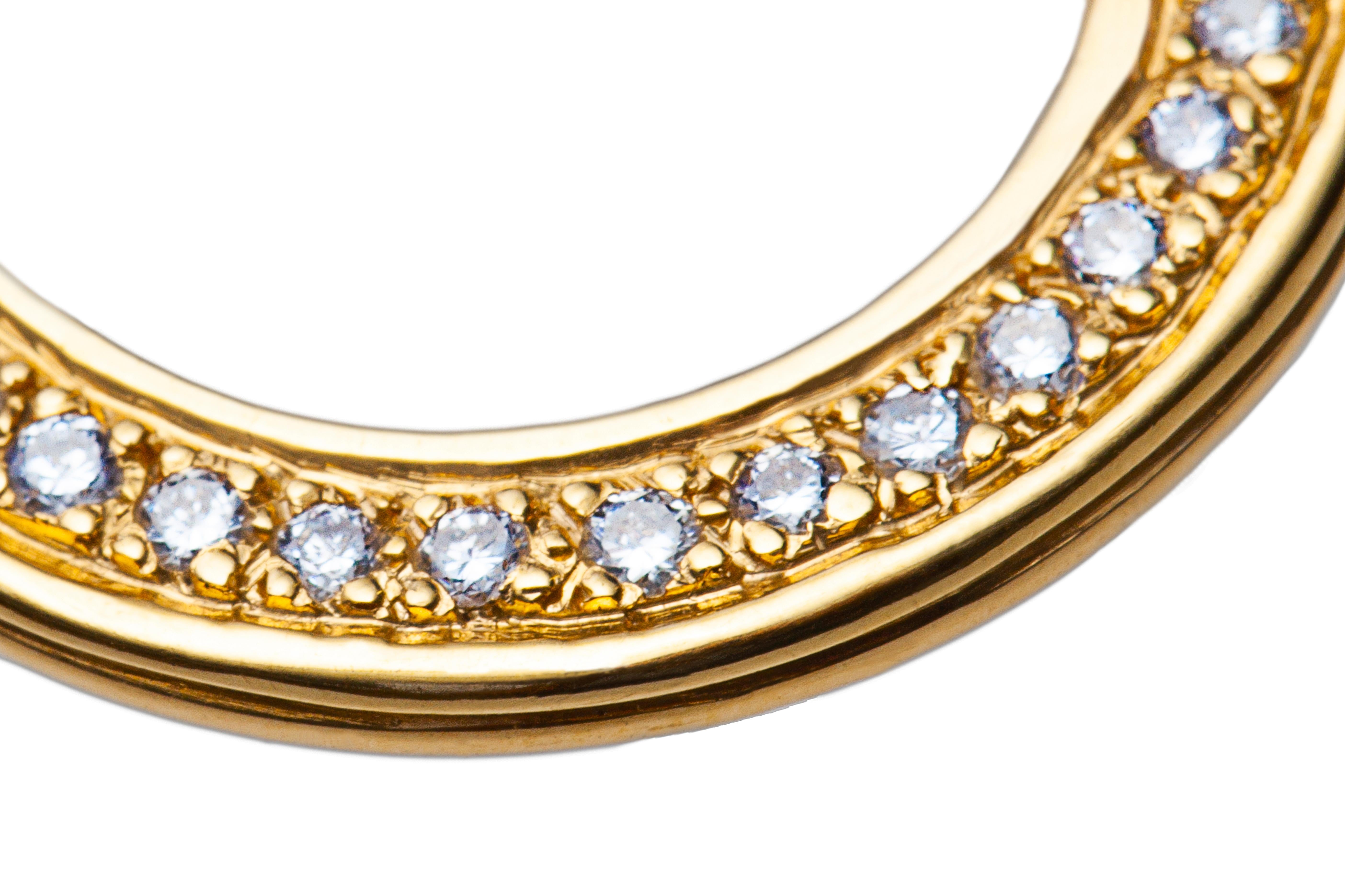Circular diamond pendant with 33 round diamonds weighing .33cts total and handmade in 18k yellow gold.