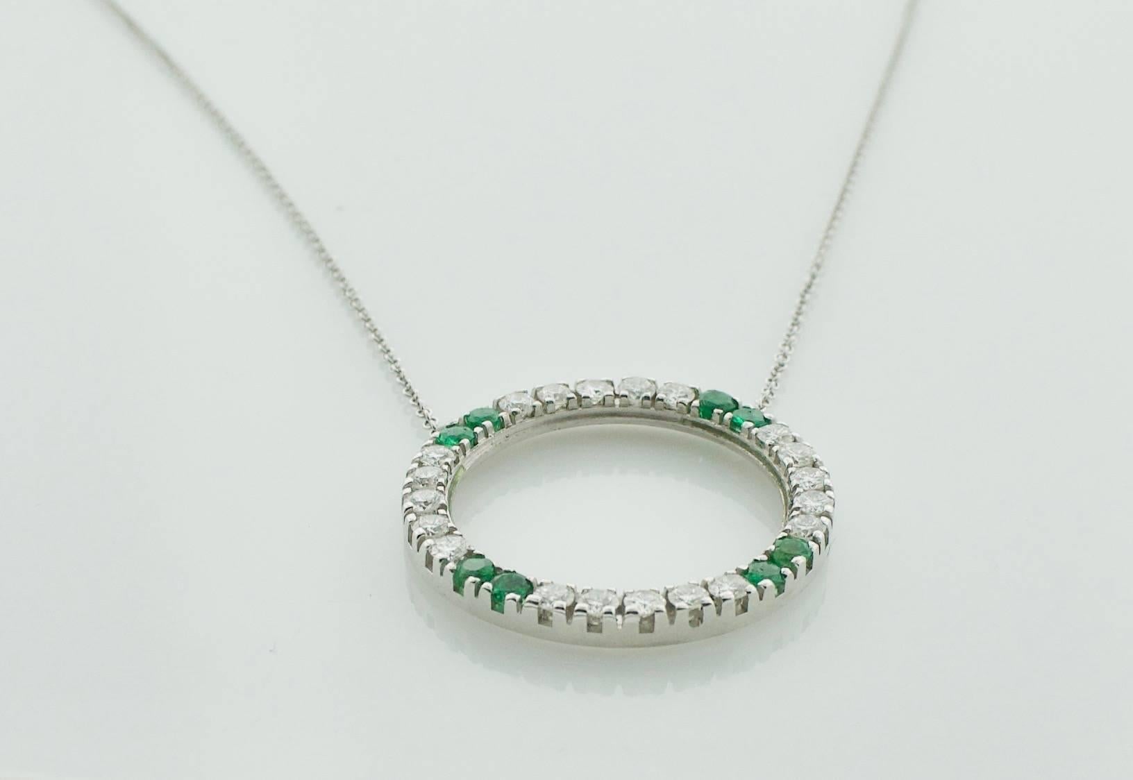 Circle Emerald and Diamond Necklace
Sixteen Inches Long
Eight Round Emeralds weighing .040 carats approximately  [The Emeralds are Bright with no imperfections visible to the naked eye]
Twenty Round Brilliant Cut Diamonds weighing .85 carats