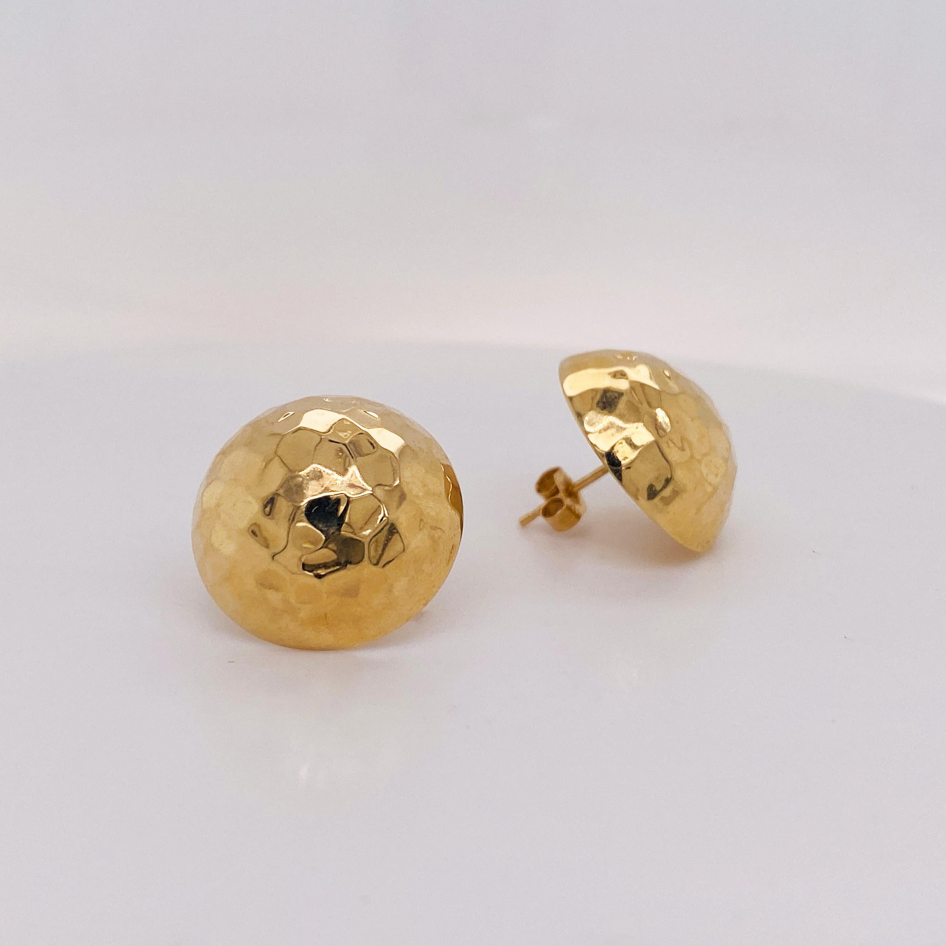 These yellow-gold circular button studs are lightweight and easy to wear. These make a great go-to accessory as they are lightweight and chic. The yellow gold goes with everything and stands out against all hair colors. Gold-hammered button earrings