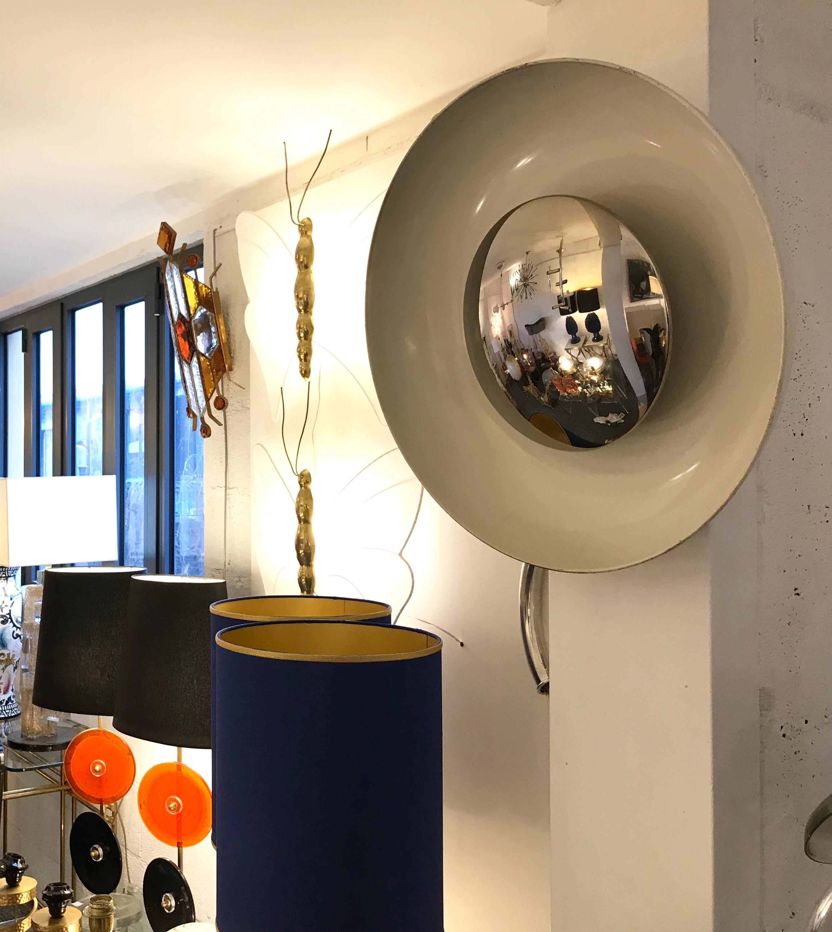 Circle white lacquered metal and chrome sconce wall light or ceiling flush mount chandelier pendants lights by the manufacture Reggiani. Some of them had the original Reggiani stamp. Come from an old cinema in Milan.
