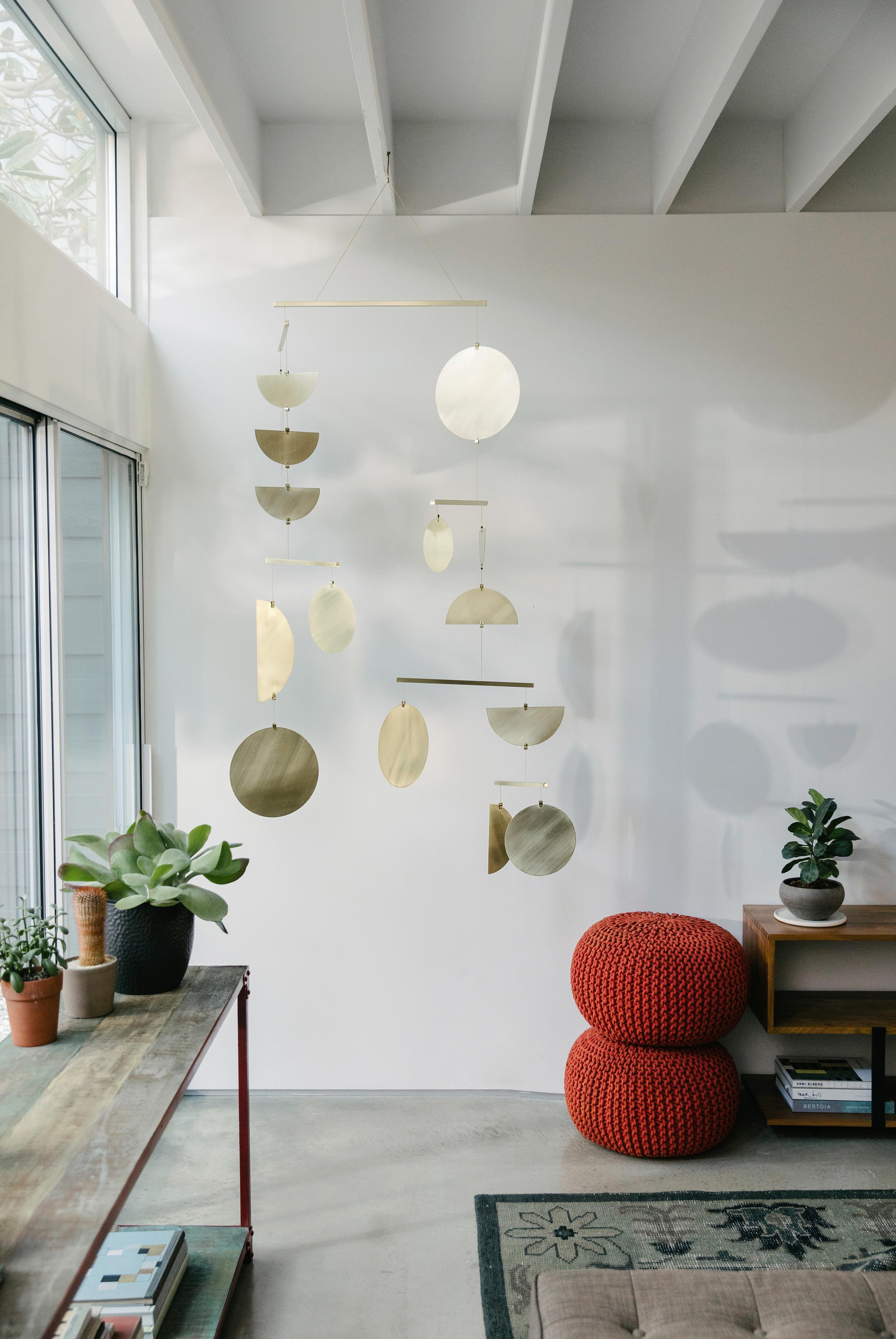 Available in three finishes, the Continuum Mobile is our most stunning mobile in both design and scale with visually cacophonous clusters of shapes that artfully glide between each other. This statement piece is ideal for large open spaces and