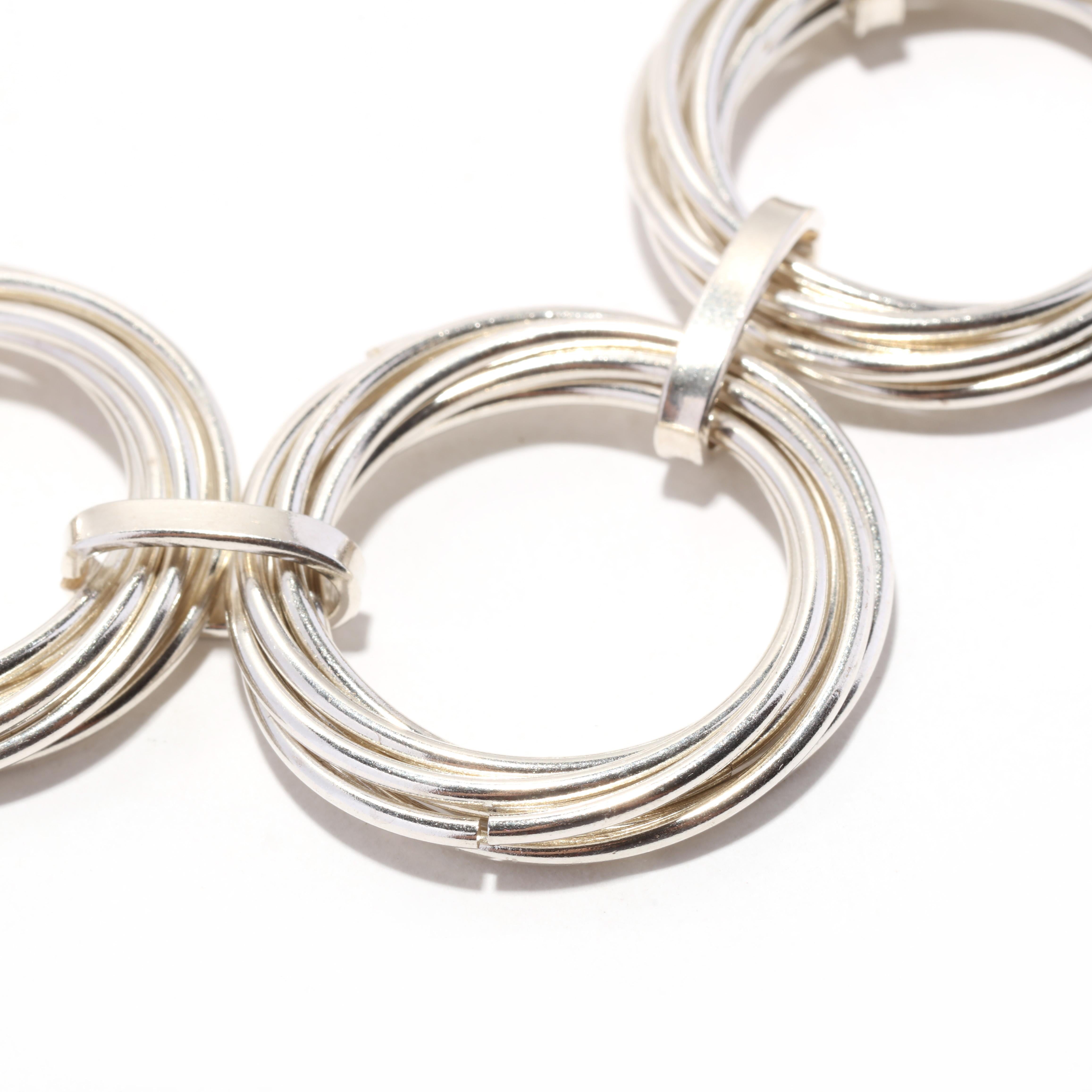 This modern sterling silver circle link bracelet is the perfect addition to any jewelry collection. The toggle closure allows you to easily slip the bracelet on and off while maintaining a secure fit. Measuring 8 inches long, the bracelet is perfect