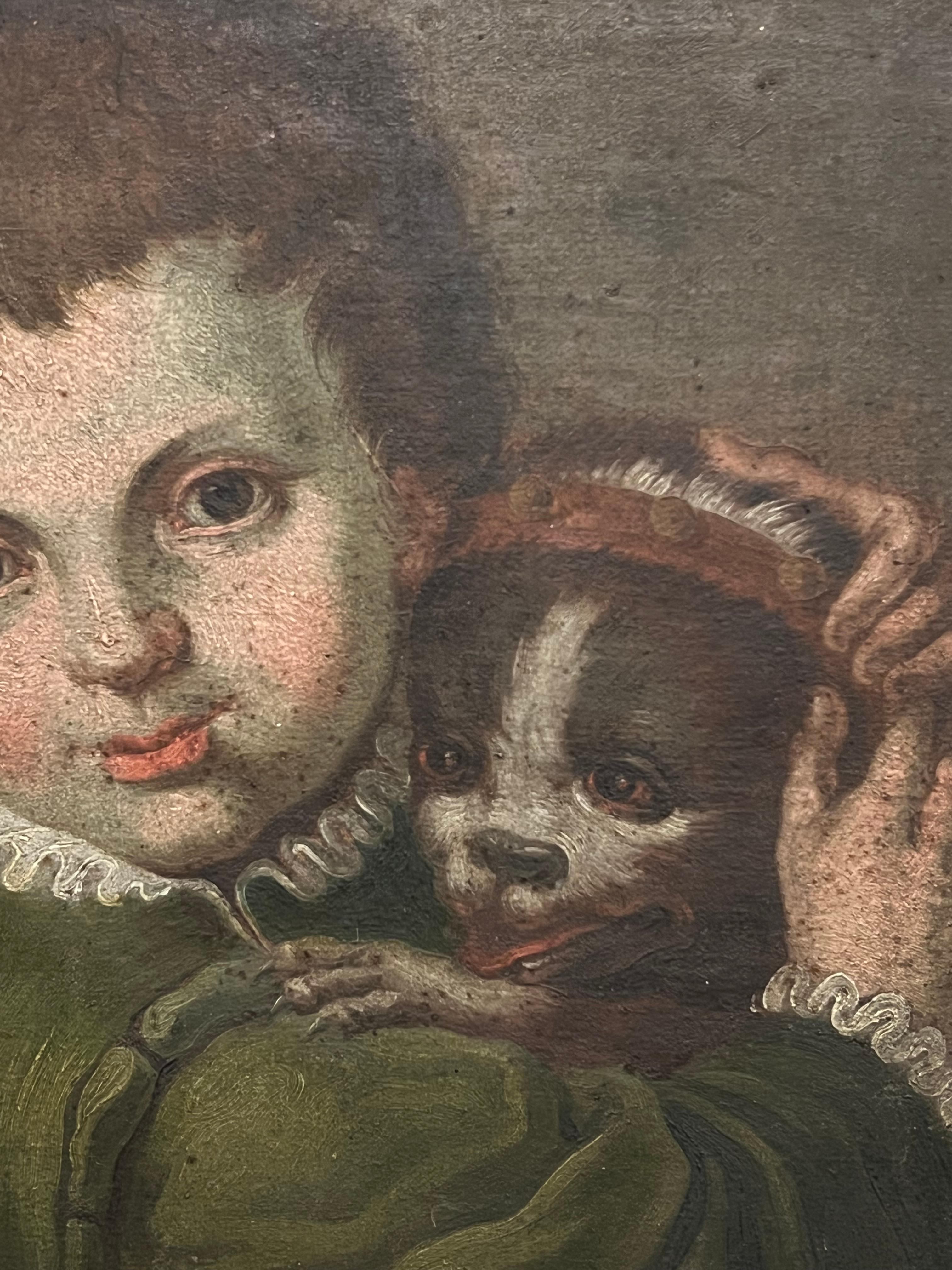 Raffinato ritratto barocco italiano del 1600 di un bambino con cane domestico dipinto ad olio - Figurative Painting Nero di circle of Annibale Carracci