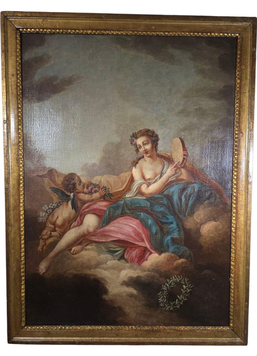 Ein elegantes Öl auf Leinwand aus dem 18. Jahrhundert, das dem Umkreis von François Boucher zuzuschreiben ist und Venus, die Göttin der Liebe und der Schönheit, in Begleitung von Amor (Amore) abbildet. Auf Wolken sitzend, mit Blumen gekrönt, hält