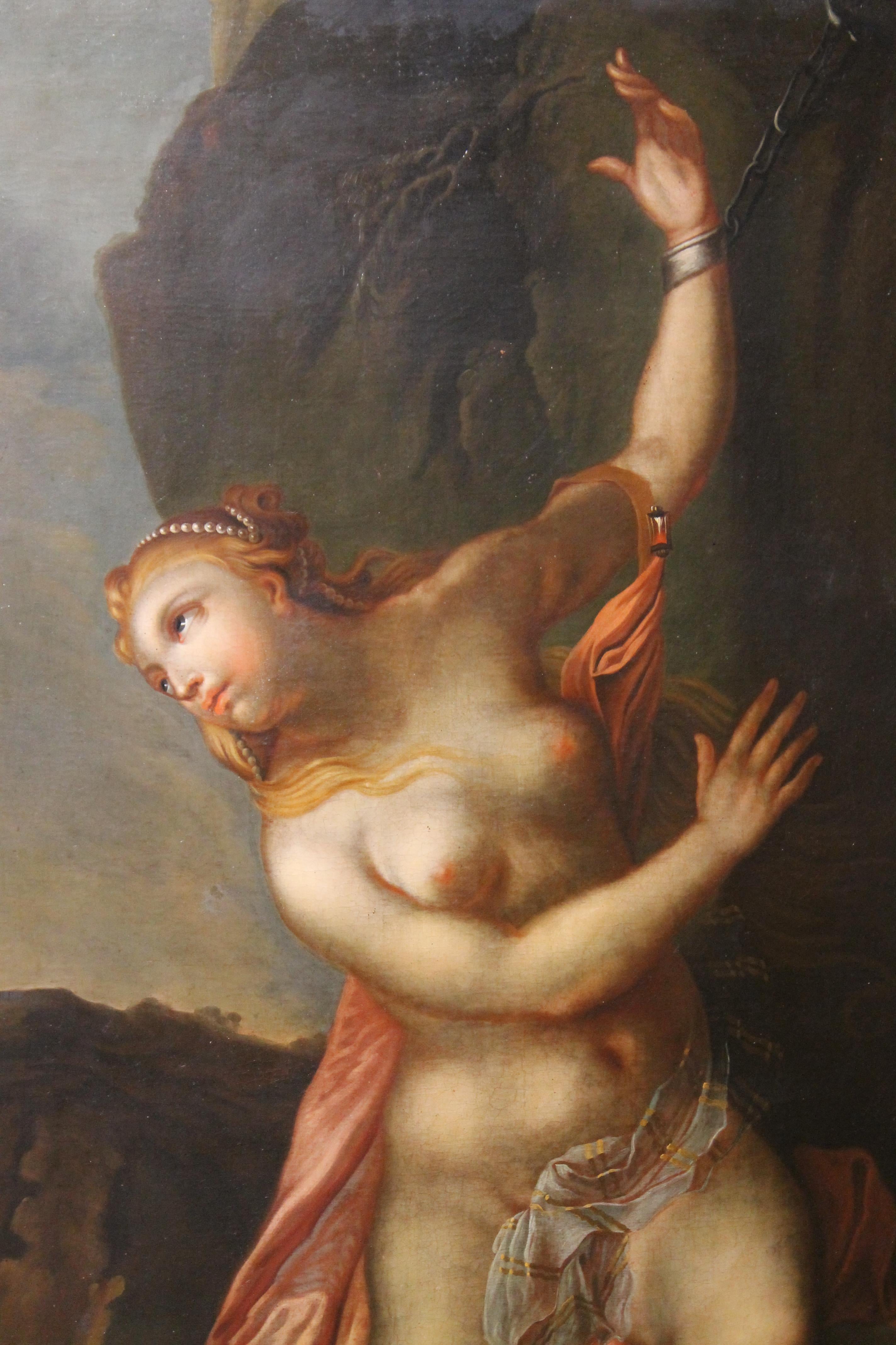 This very fine rectangular oil on canvas is an old master painting depicting a naked woman in chains dressed only in pink, white and golden drapes that descend from her left shoulder, closed by a big red ruby jewel. Her long blonde loose hair is