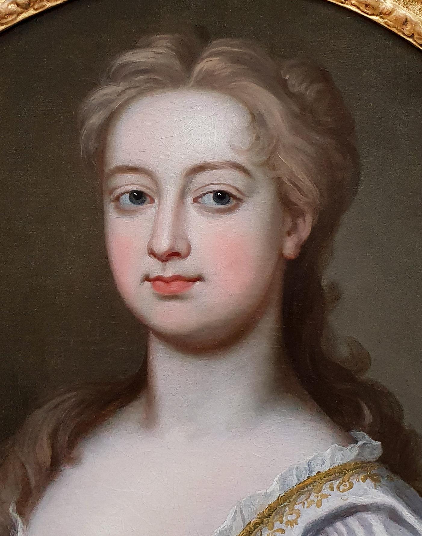 Titan Fine Art are pleased to present this charming picture which was painted circa 1725 - it is of a type favoured by the extraordinarily successful artist, Sir Godfrey Kneller.  The sitter has been portrayed in a luxurious silk dress with gold