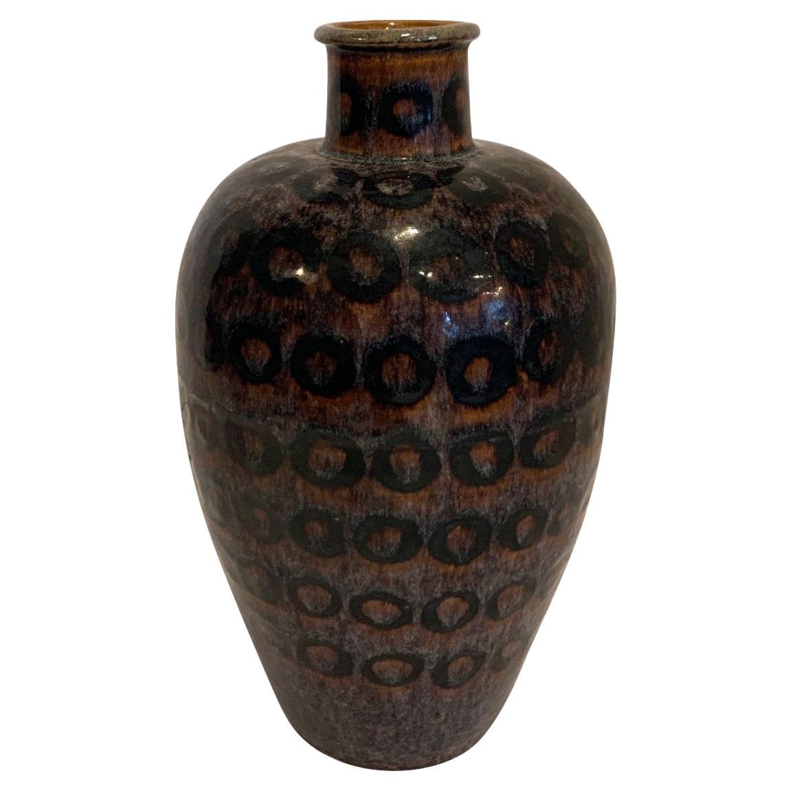 Chinese tall with thin spout ceramic vase.
Decorative black circles.
Sits nicely with taller S5504.

