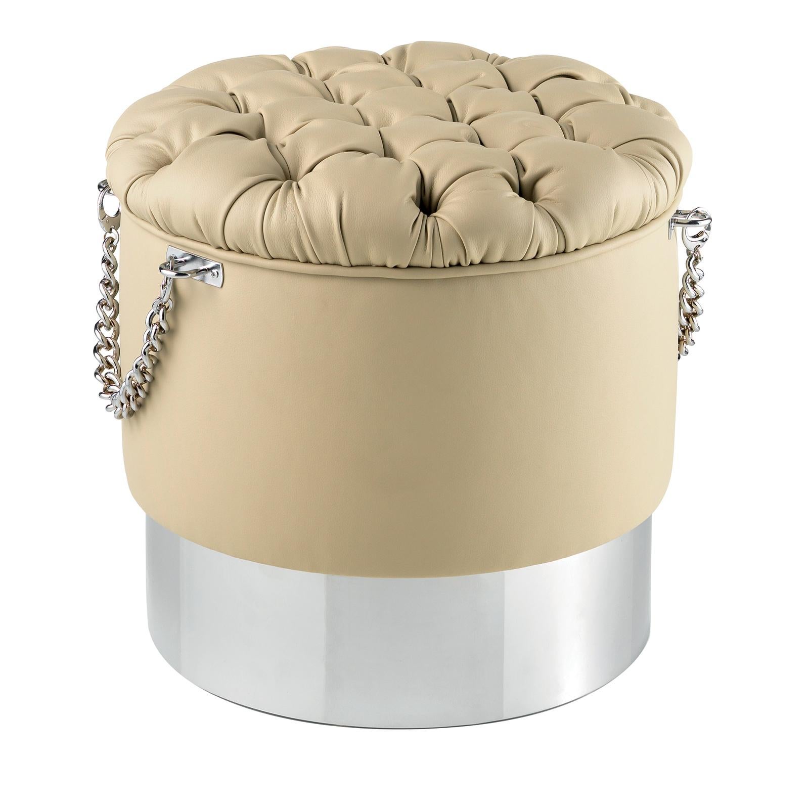 From a series of one of three poufs, this piece will add a bold and sophisticated accent to a modern home. This piece has a round structure in metal with a polished nickel finish, whose cool and smooth look is visible in the plinth base and two
