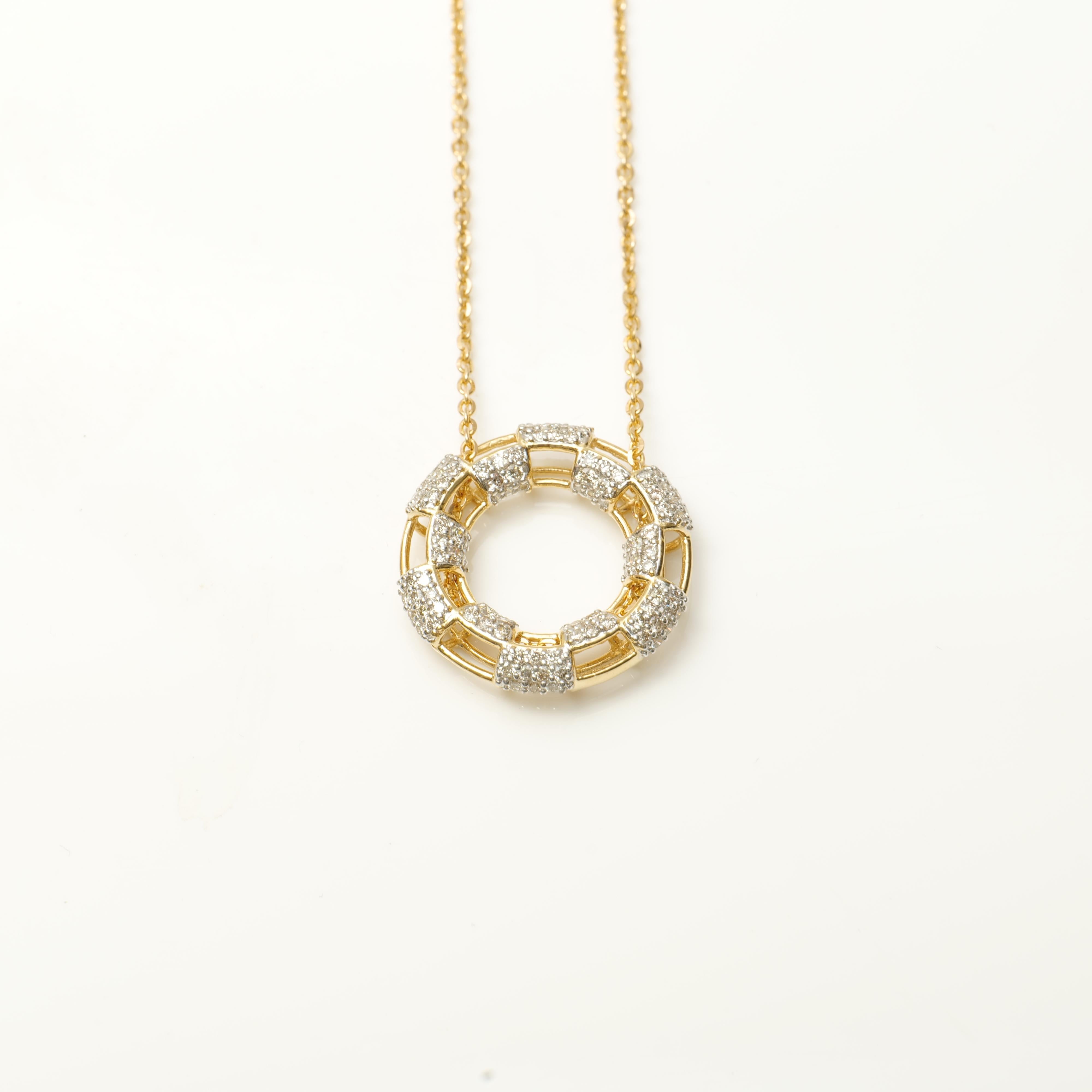 
The Circle Round Diamonds Pendant Necklace in 18K Solid Gold is a captivating and elegant piece of jewelry. It features a beautiful design with concentric circles adorned with brilliant round diamonds, all crafted from high-quality 18K solid gold.