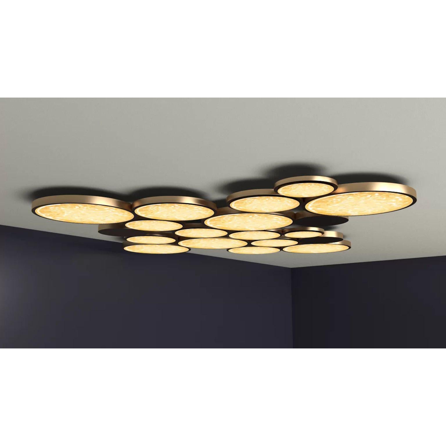 Circles Flush Mount by Dainte
Dimensions: Ø 122 x H 50 cm.
Materials: Glass and brass. 

Dimensions may vary. Please contact us. 

A extraordinary mega circular chandelier featuring a combination of twelve textured glassand brass circles to create