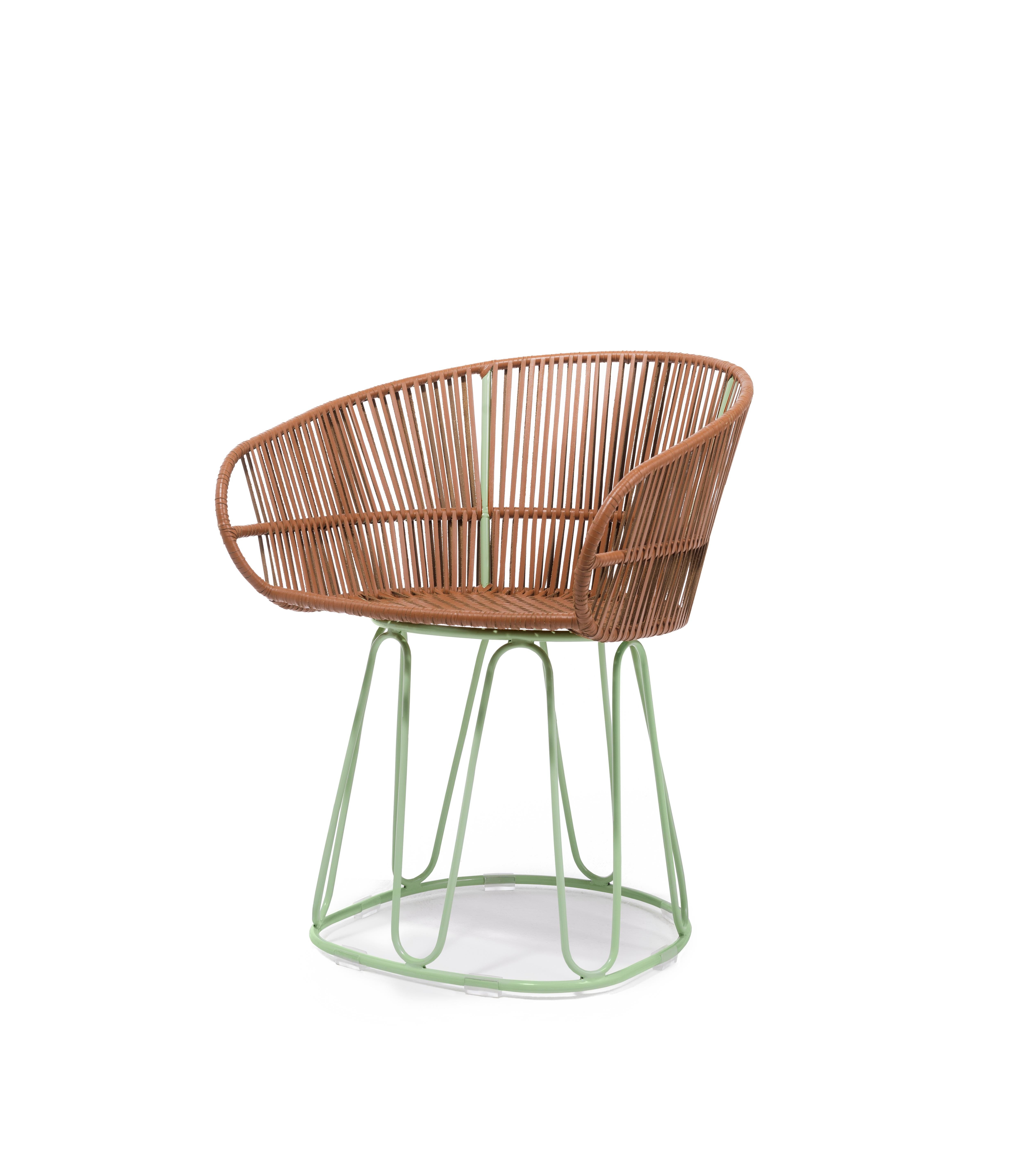 Circo dining chair leather by Sebastian Herkner
Materials: Galvanized and powder-coated tubular steel. Leather. 
Technique: Weaved by local craftspeople in Colombia. 
Dimensions: W 61.5 x D 56.5 x H 77.5 cm
Available in colors: cognac/ menta,