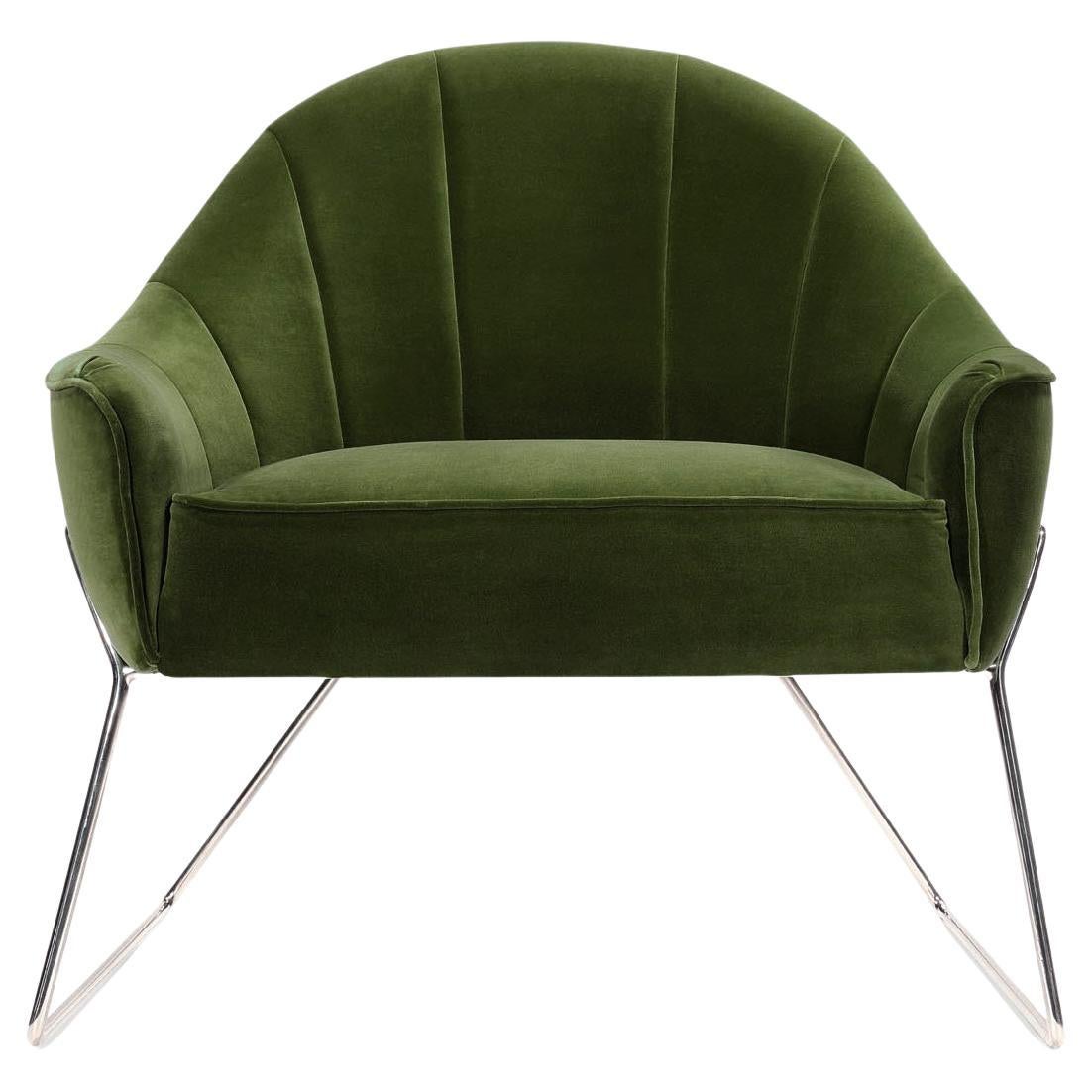 Circu armchair upholstered in green velvet by Bow and Arrow