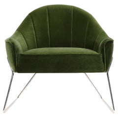 Circu armchair upholstered in green velvet by Bow and Arrow