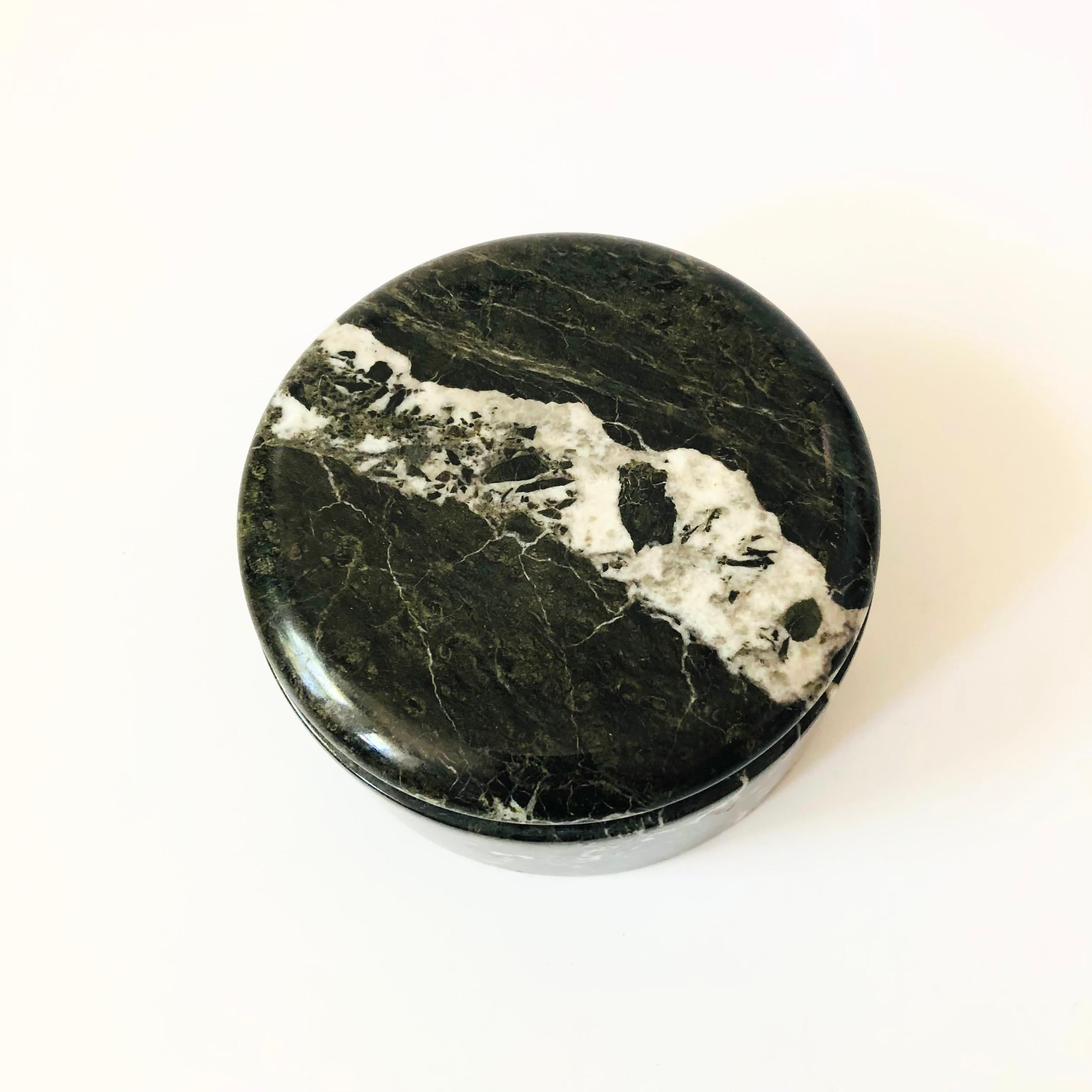 A vintage circular stone box. Beautiful and dramatic natural white veining contrasting against a black base color of the stone.

