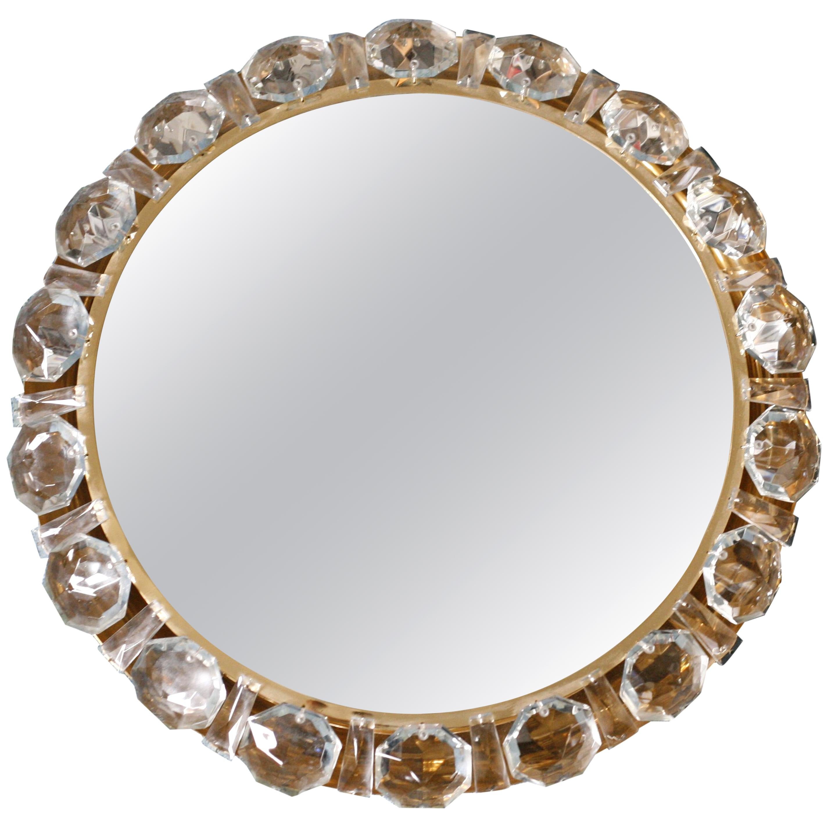 Circular shaped Palwa mirror high polished brass frame surrounded by diamond shaped chunky cut crystal.
Christoph Palme, Germany, 1970.
Lid up by 4 European candelabra bulbs.
 
    
 