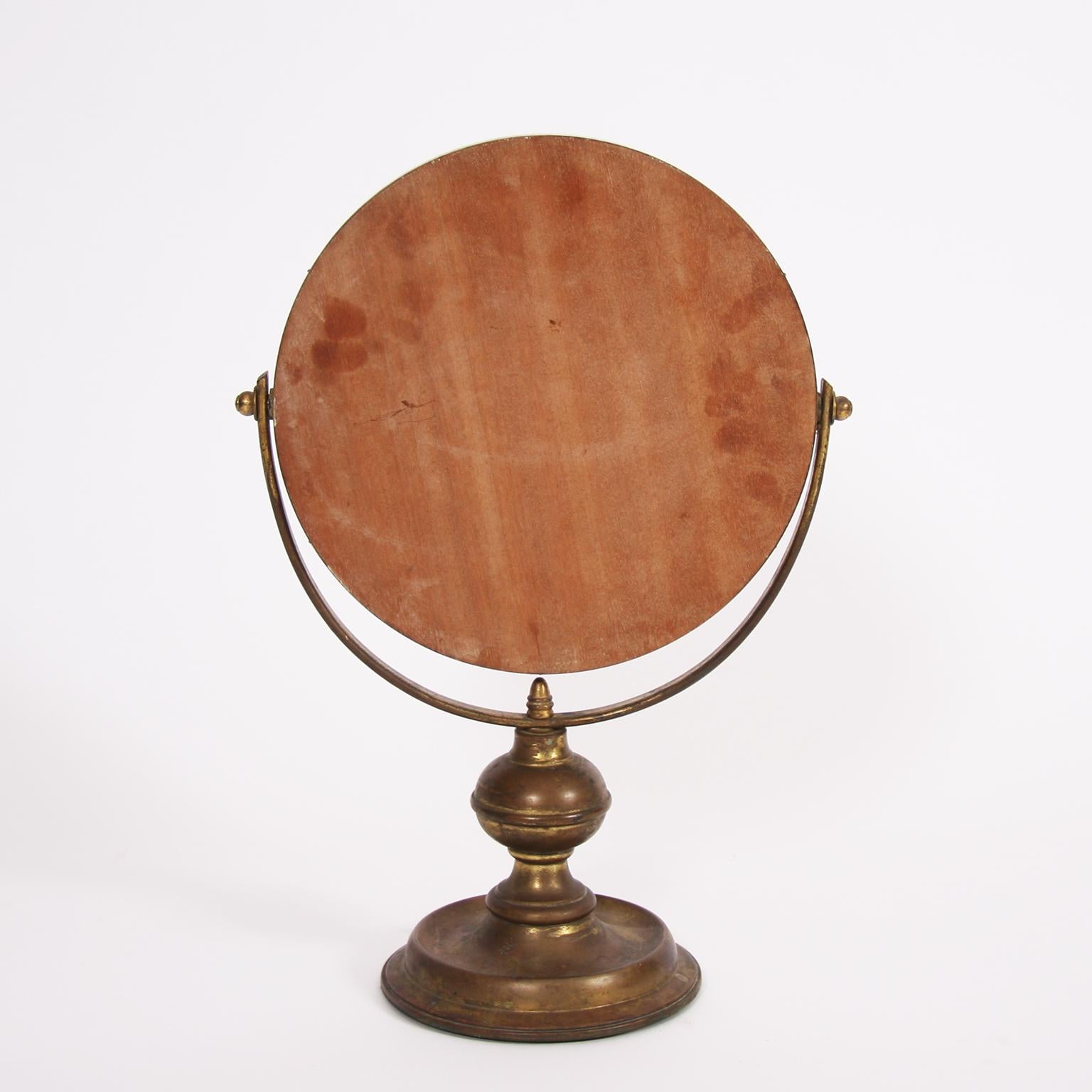 French, circa 1950.

A beautiful, circular, brass vanity mirror. Lovely patina to the brass.