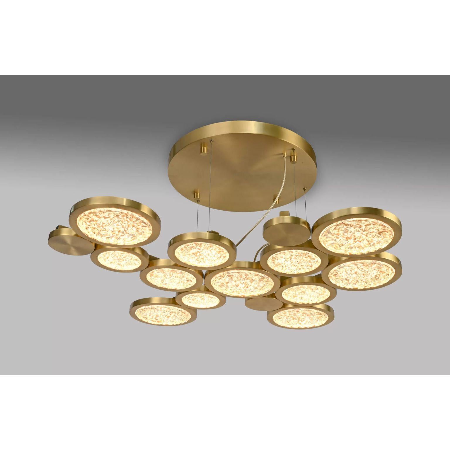 Circular Chandelier by Dainte
Dimensions: Ø 122 x H 150 cm.
Materials: Glass and brass. 

Dimensions may vary. Please contact us. 

A extraordinary mega circular chandelir featuring a combination of twelve textured glassand brass circles to create