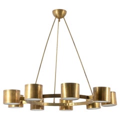 Circular chandelier in matte golden brass. Contemporary Italian work.