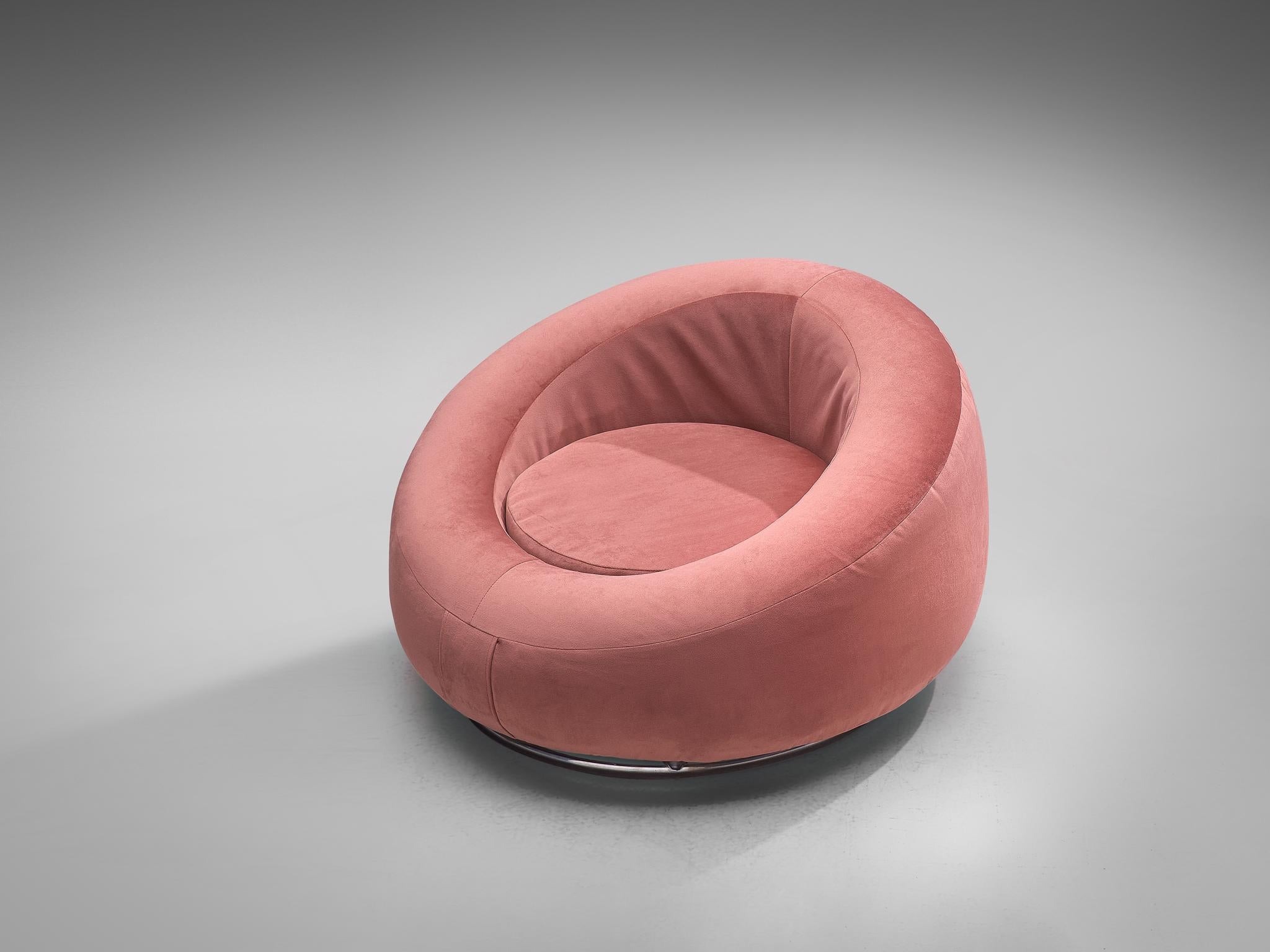 Club chair, pink velvet and chromed metal, Italy, 1970s.

This lounge chair has a gorgeous Hollywood Regency feel. The low seat features a circular shape with a thick shell around that functions as backrest and armrests. This shell is rounded as