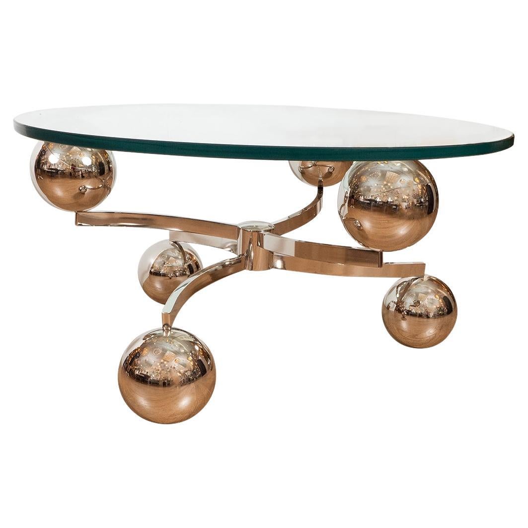 Circular coffee table featuring ball form elements For Sale