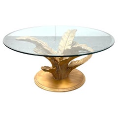 Circular Coffee Table With Carved Wood Palm Leaf Base