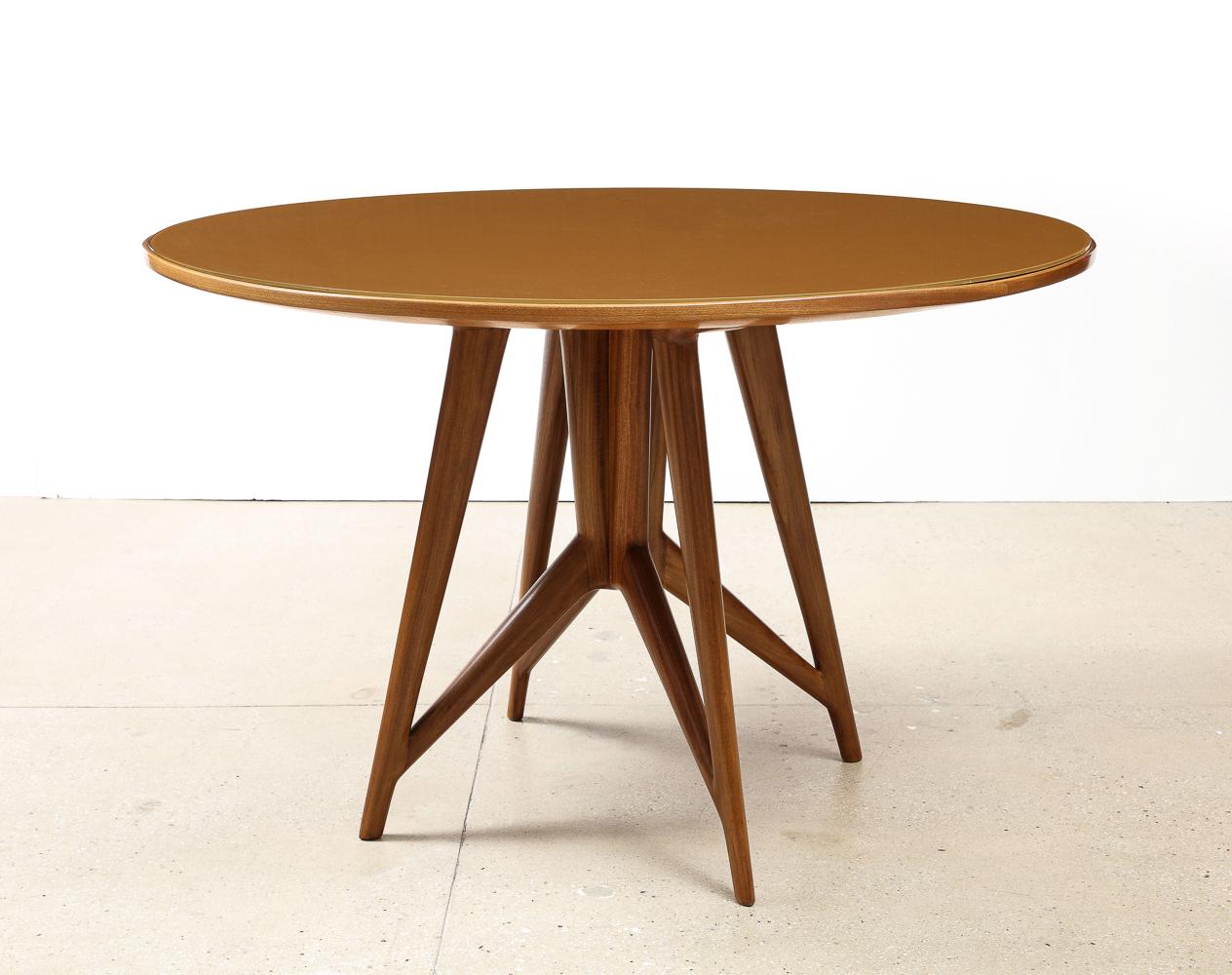 Walnut, back-painted glass. Circular table with a great architectural base and inset glass top. Unattributed, but definitely Italian.